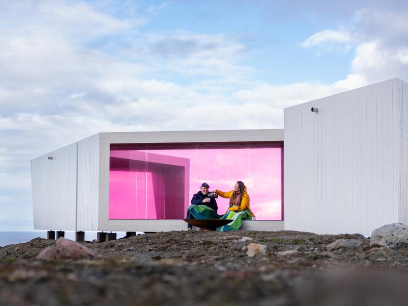 Two poeple sitting in Domen viewpoint by Biptope in Varanger, Northern Norway
