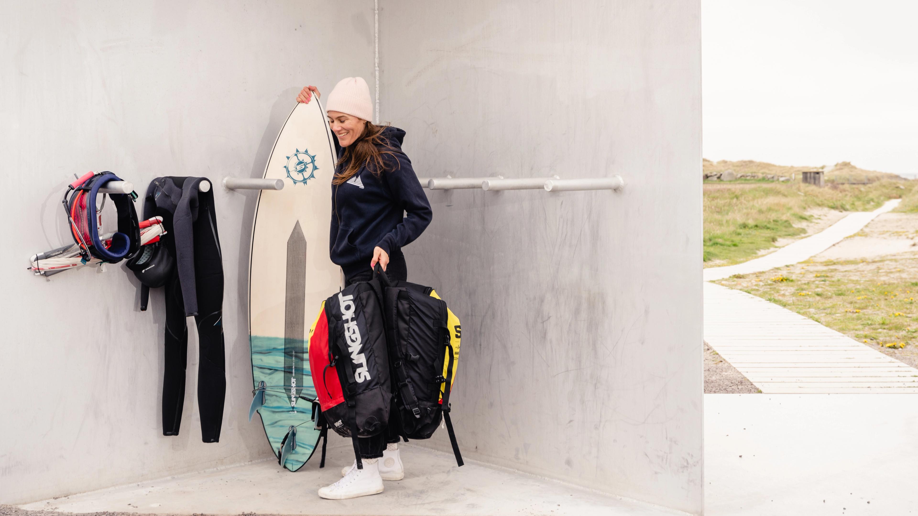A woman getting ready to go water kiting at Jæren, the Stavanger Region, Fjord Norway.