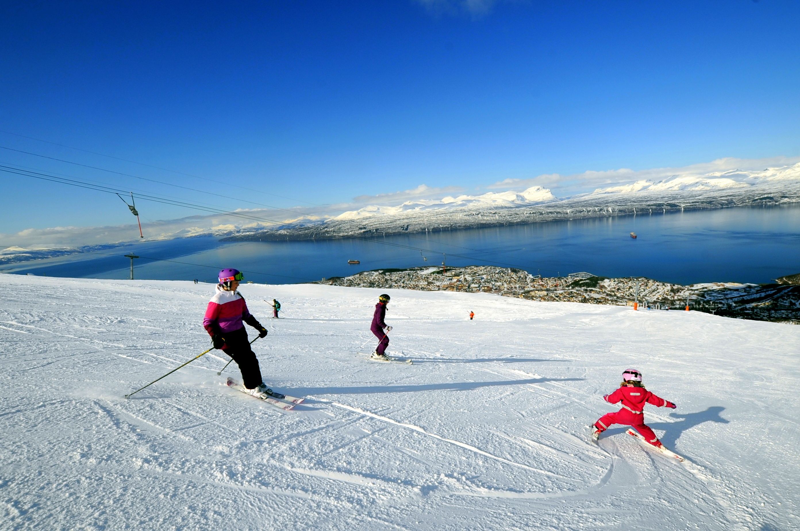 People are skiing at Narvikfjellet ski resort in Narvik, Northern Norway