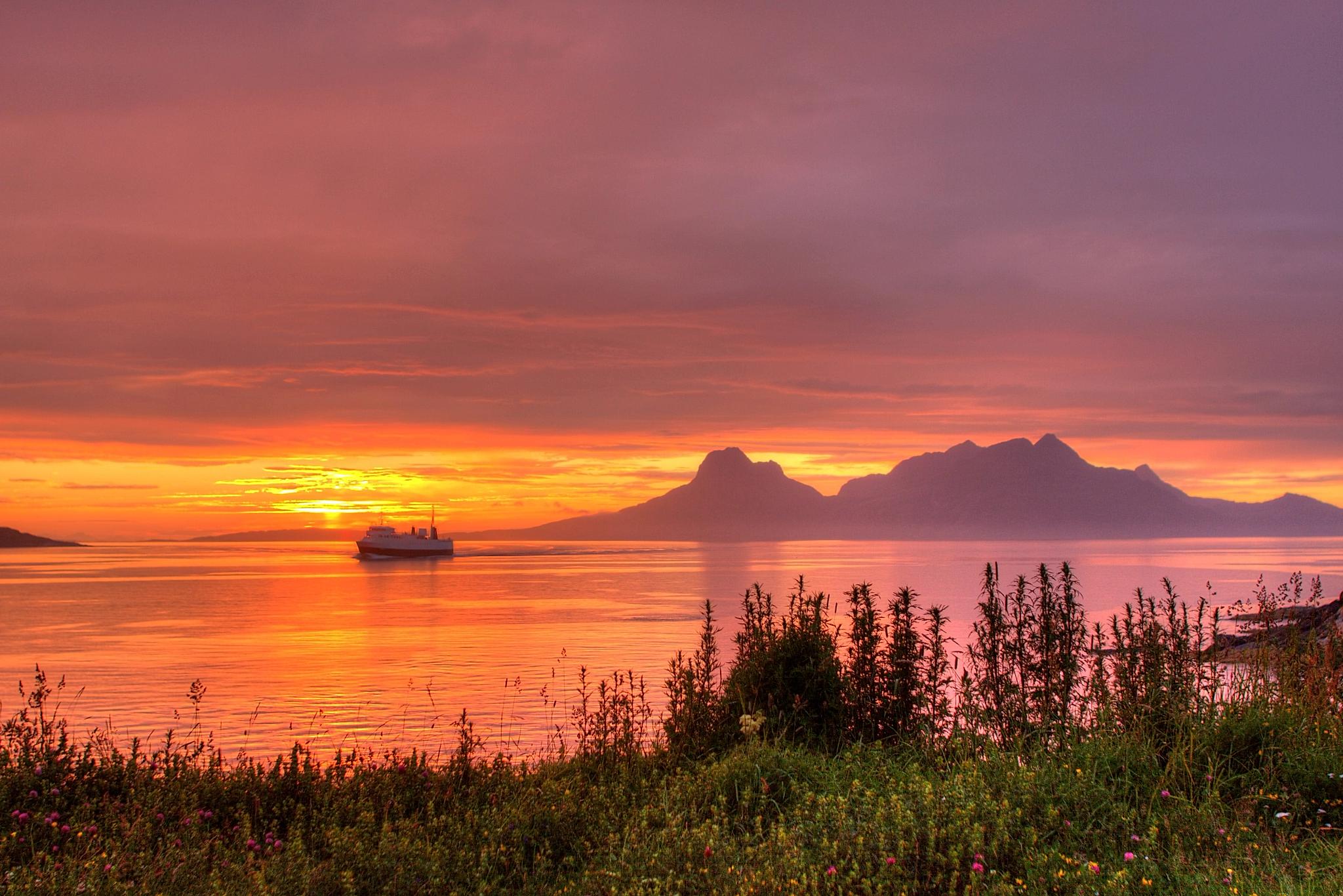 The sea under the midnight sun near Bodø, Salten, Northern Norway