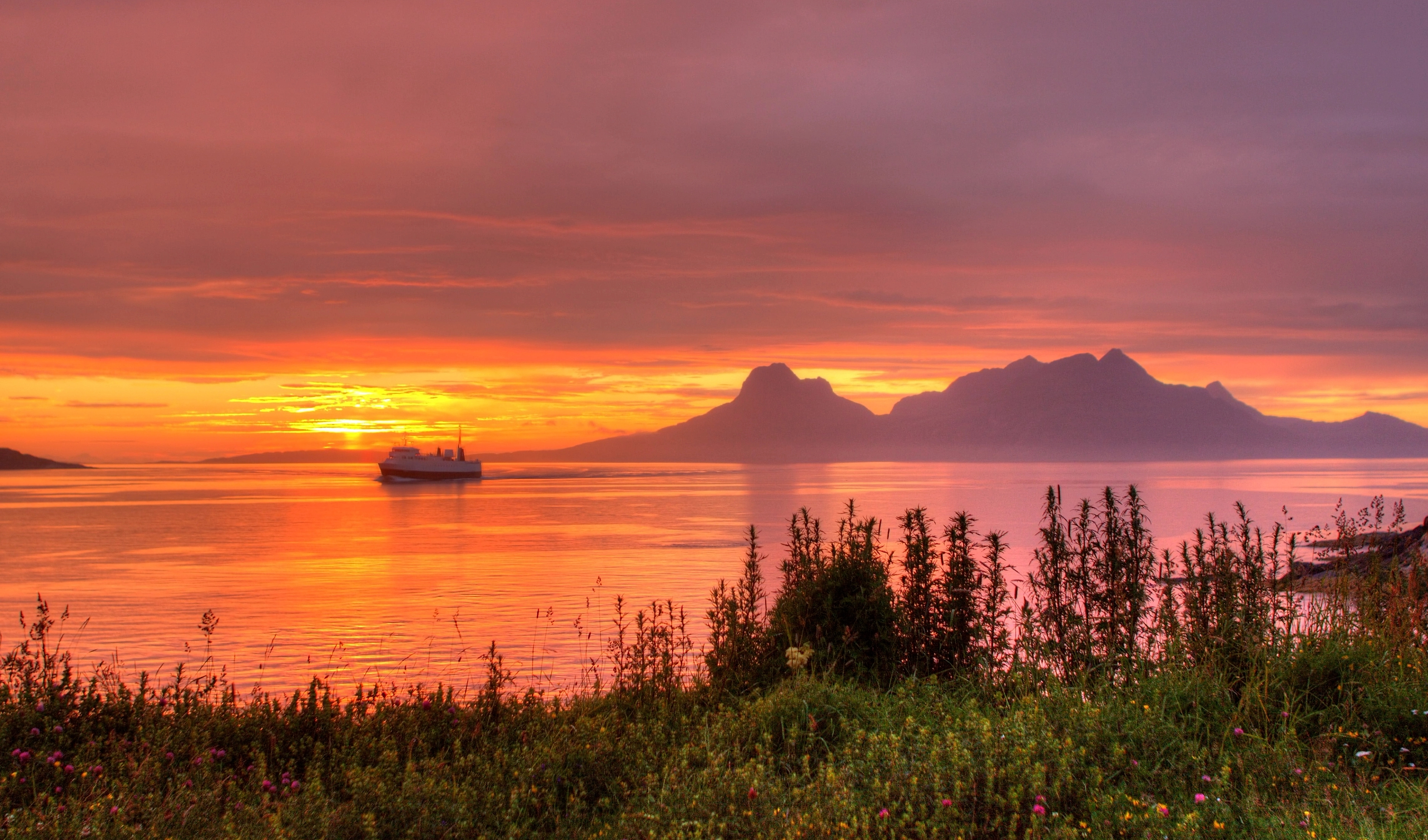 The sea under the midnight sun near Bodø, Salten, Northern Norway