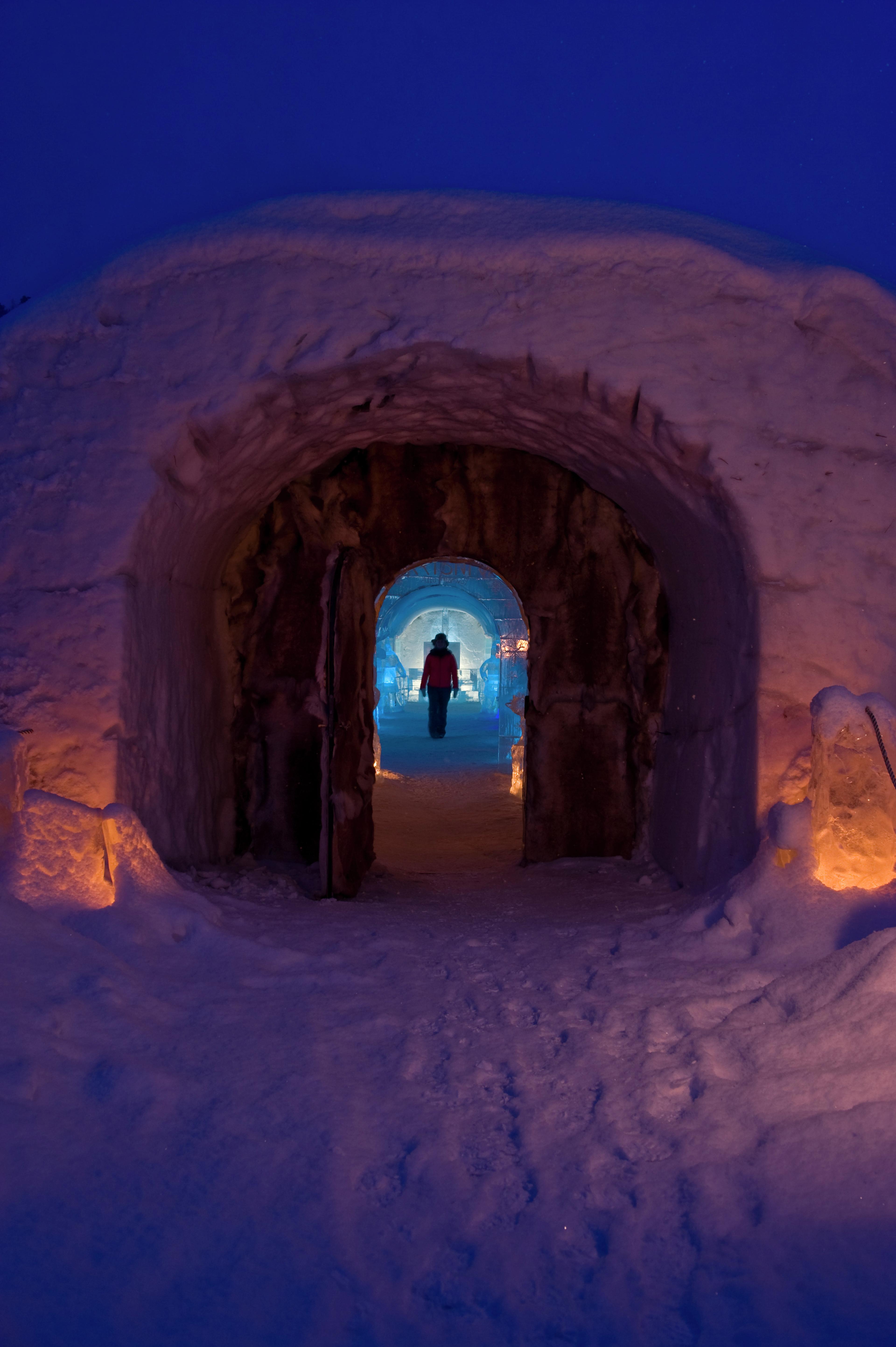 A person in silhouette at the Sorrisniva Igloo Hotel in Finnmark, Northern Norway