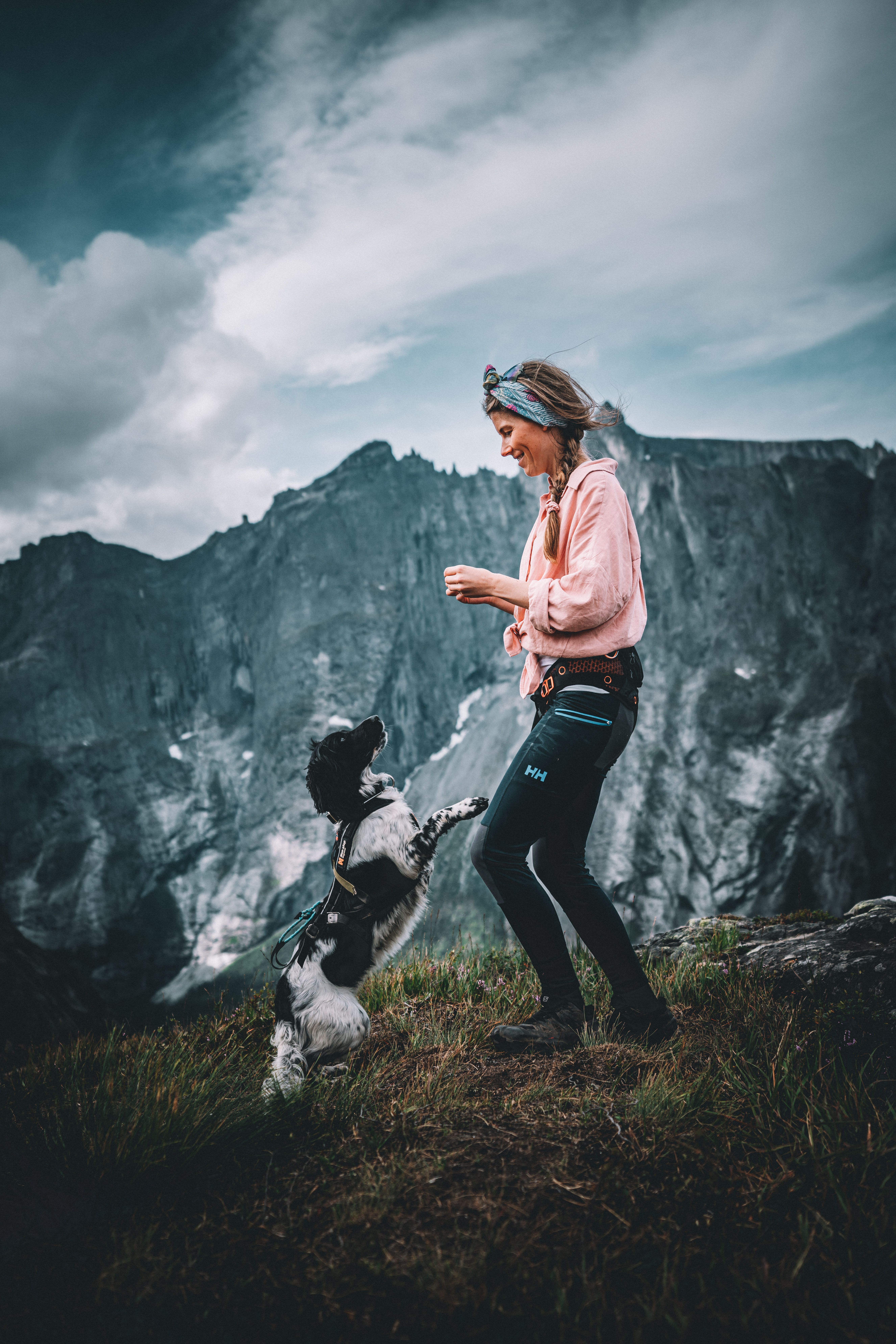 Dog and woman playing at Litlefjellet mountain, Romsdal