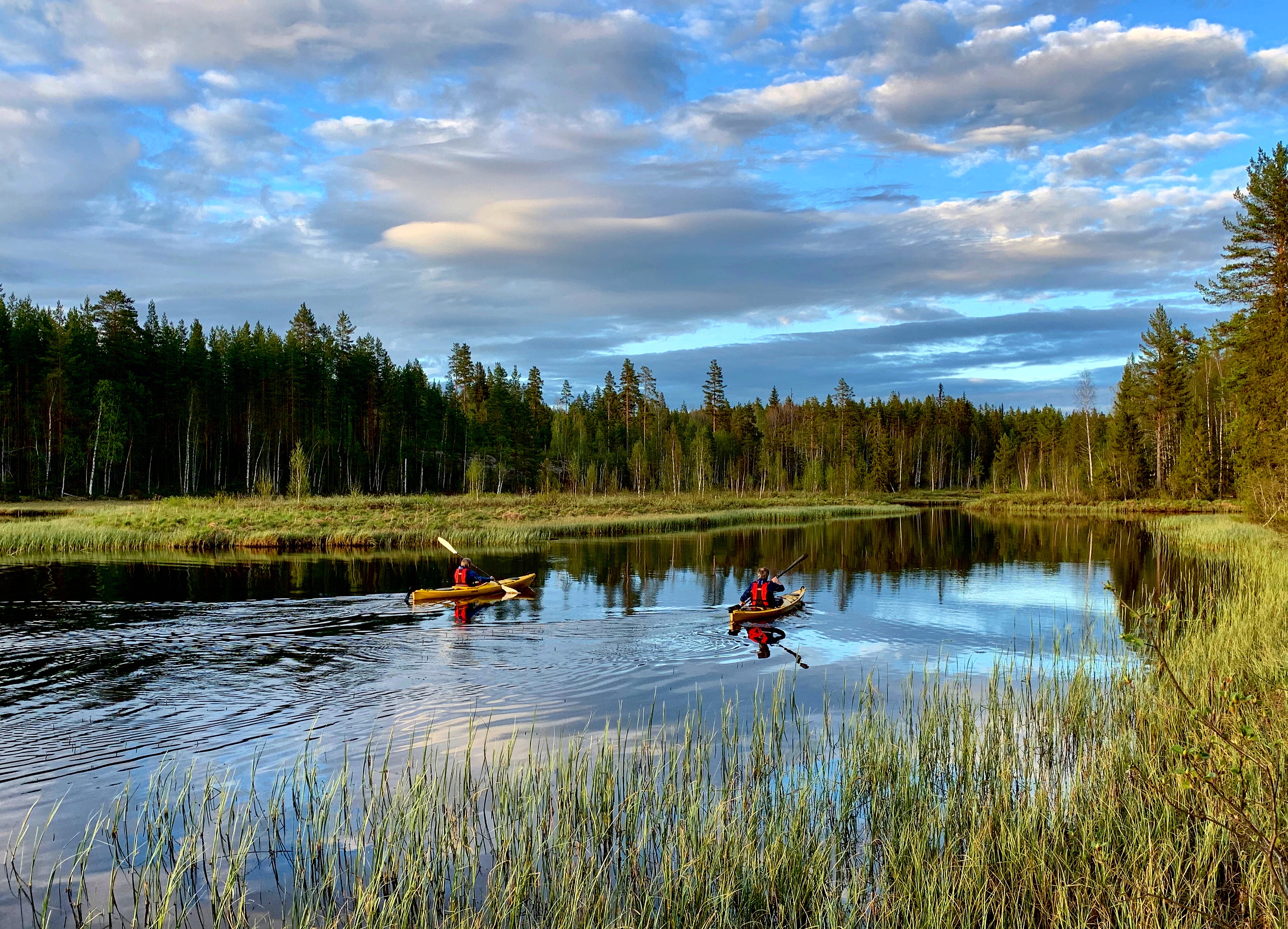 Two people canoeing in Kynna in Innlandet county in Eastern Norway