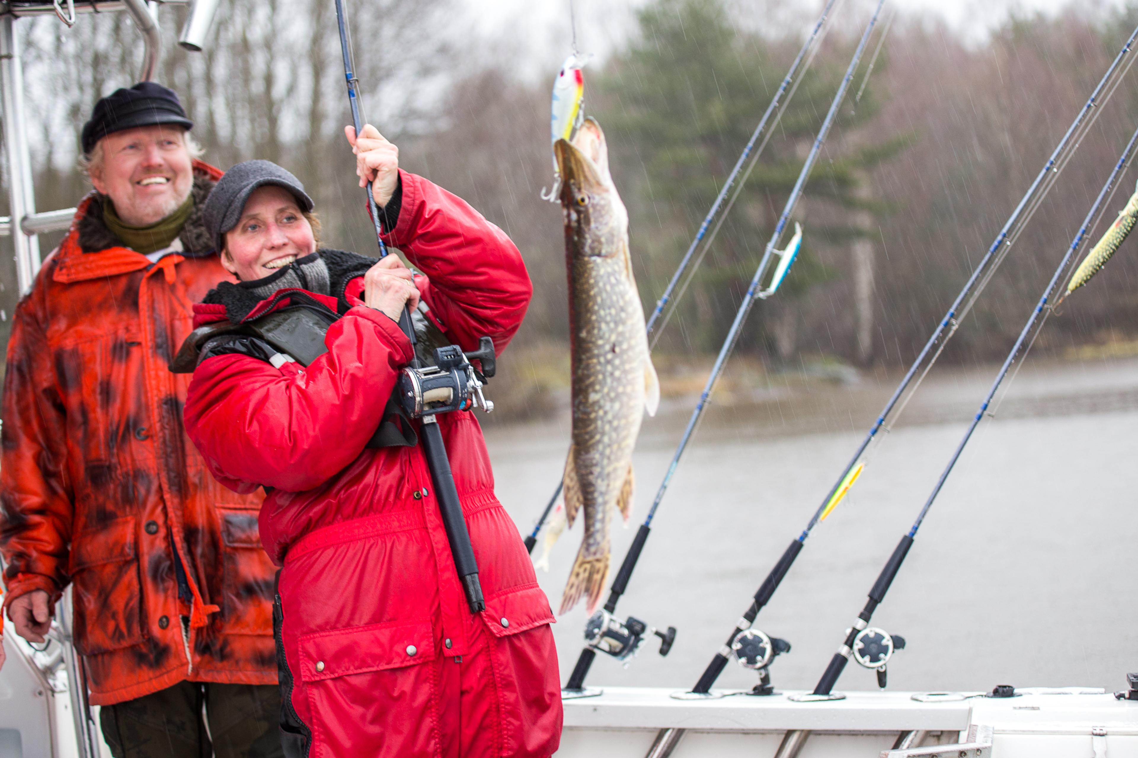 A woman fishing in the Halden Canal in Eastern Norway.