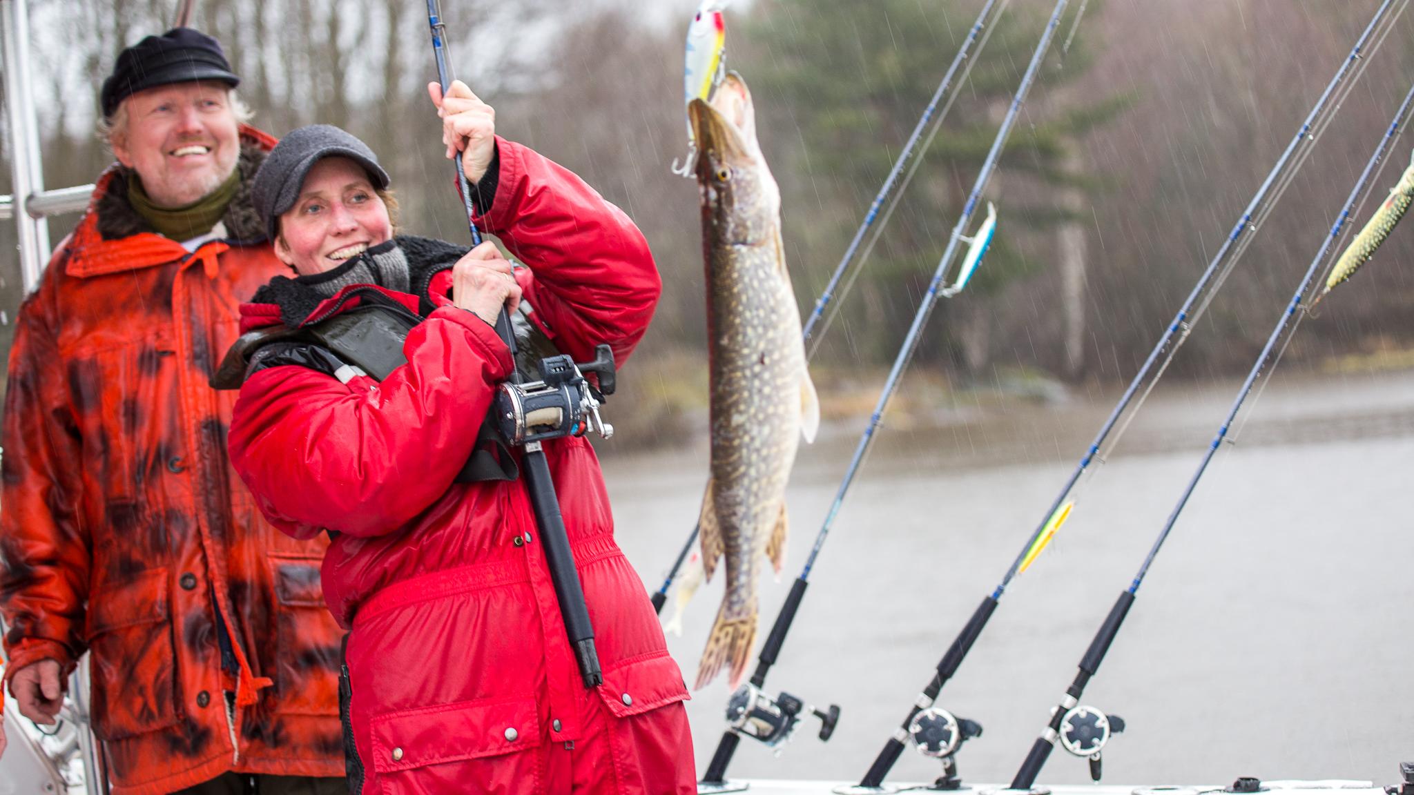 A woman fishing in the Halden Canal in Eastern Norway.