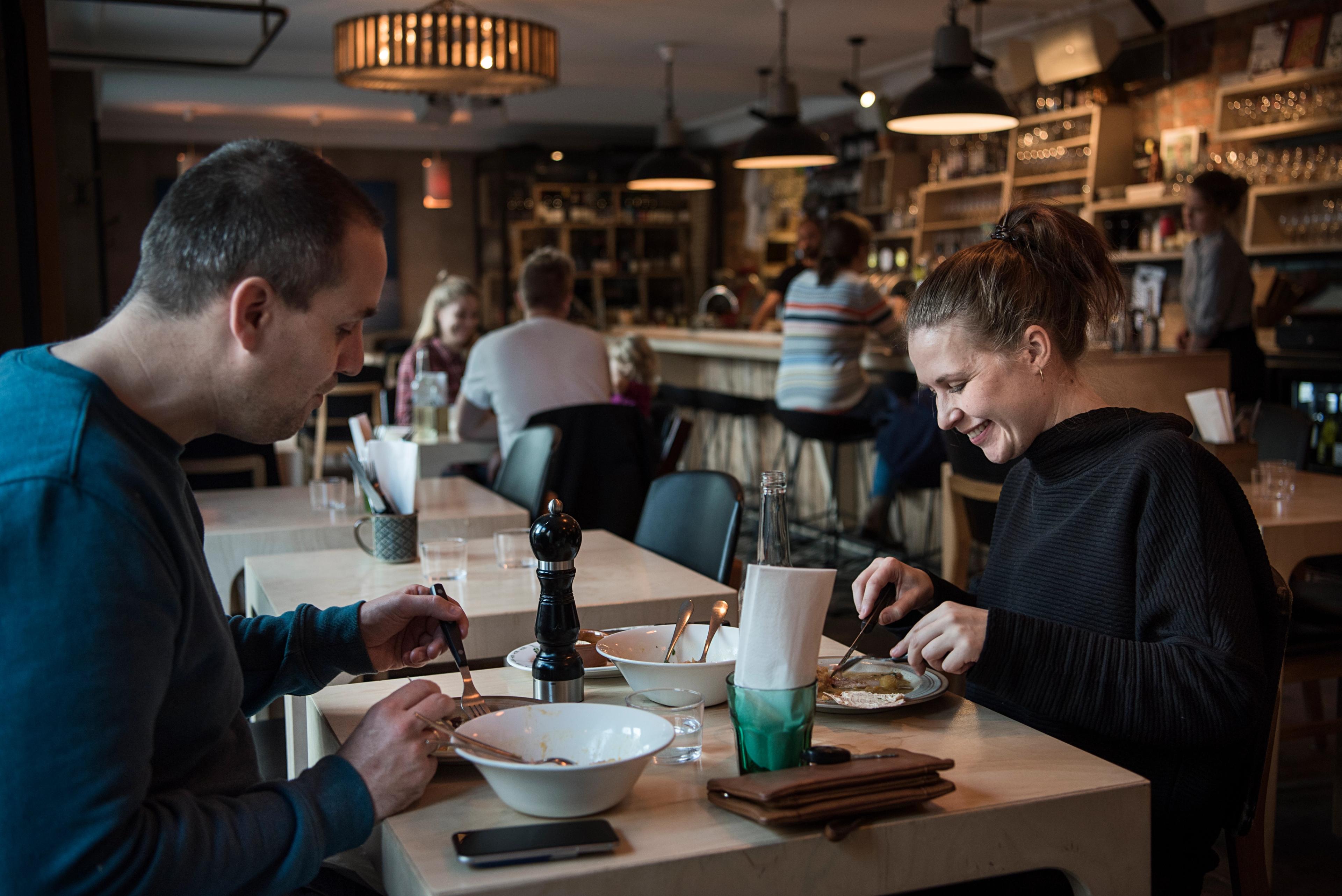 Two people having lunch at Smalhans restaurant, Oslo, Eastern Norway