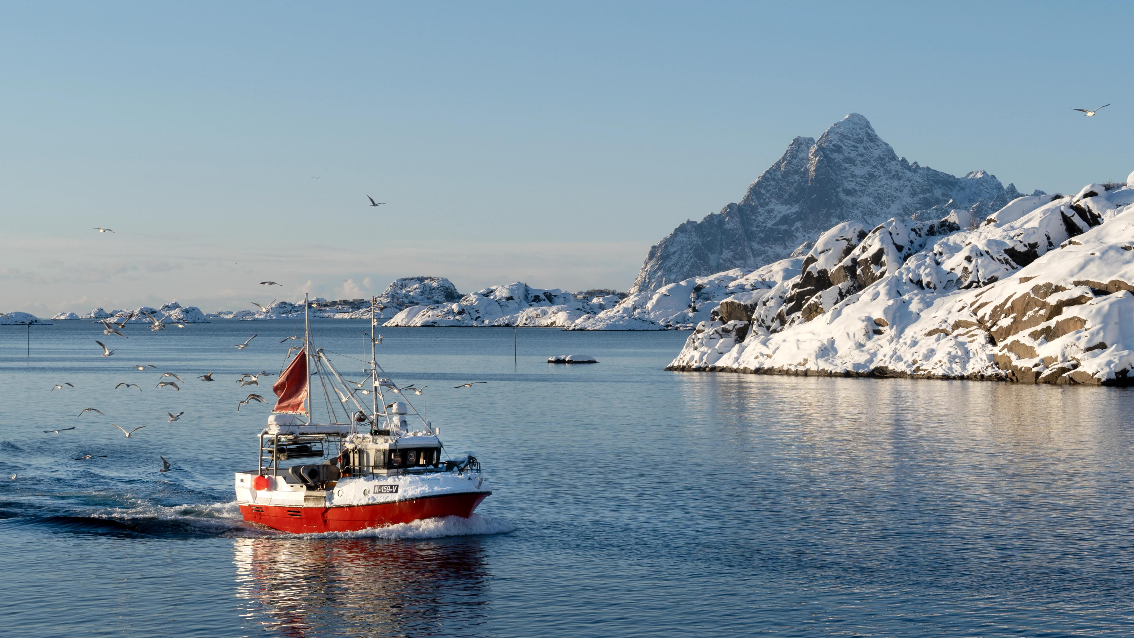 Skrei fishing boat in front of Vågakallen mountain in Lofoten