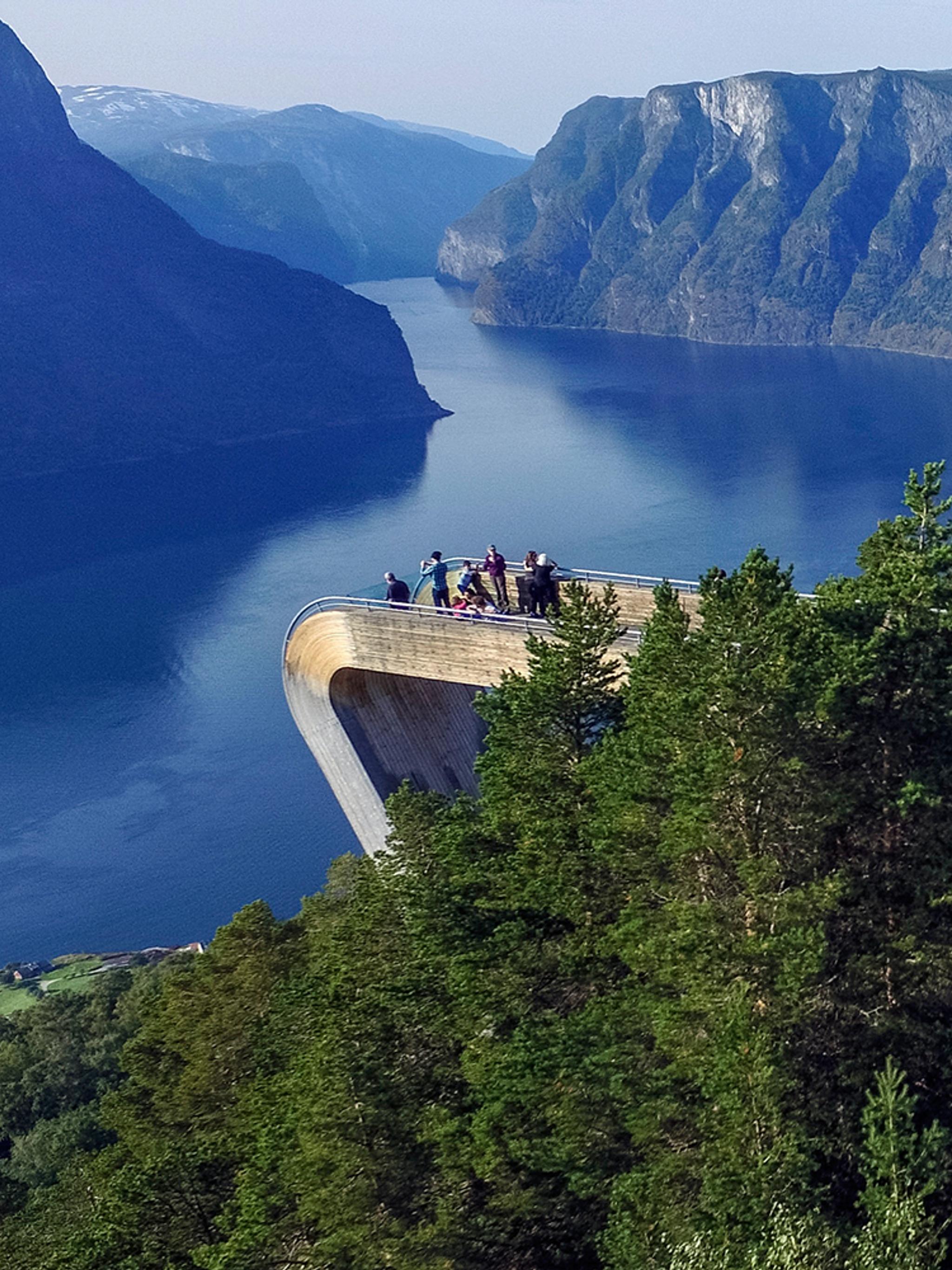 People standing at the Stegastein viewpoint along the Norwegian Scenic Route Aurlandsfjellet