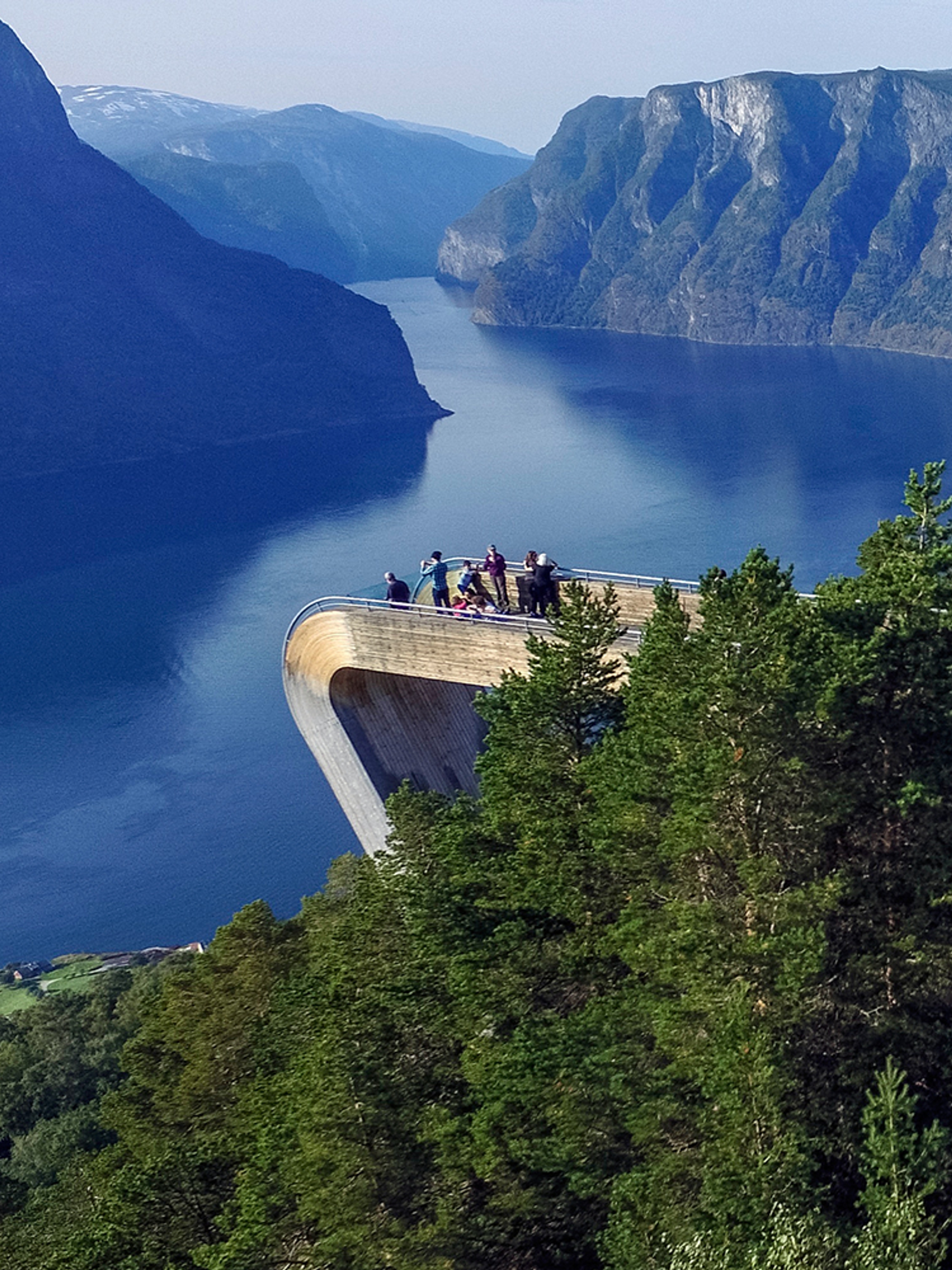 People standing at the Stegastein viewpoint along the Norwegian Scenic Route Aurlandsfjellet