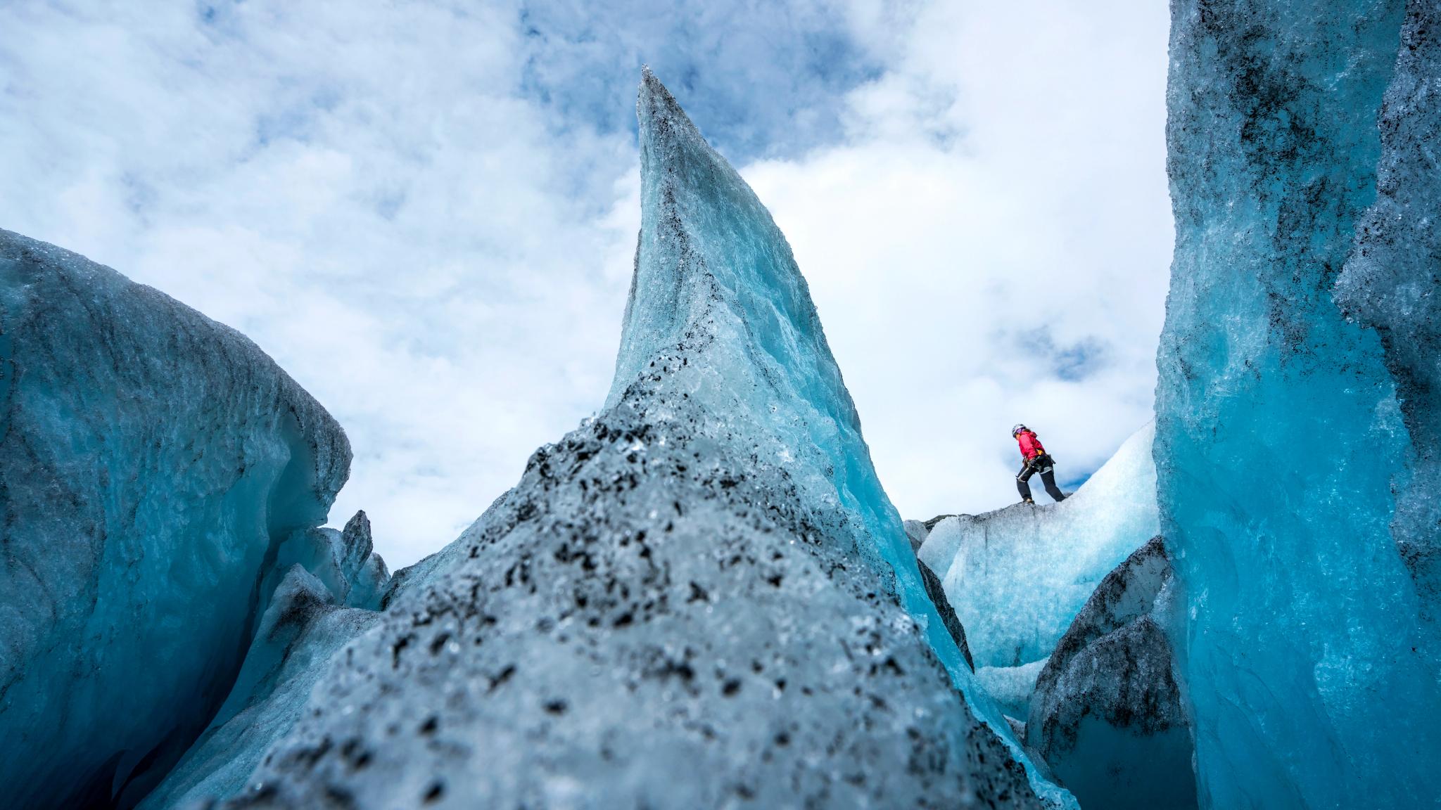 A person is hiking on the Nigardsbreen glacier in the Jostedalen valley in the Sognefjord area of Fjord Norway