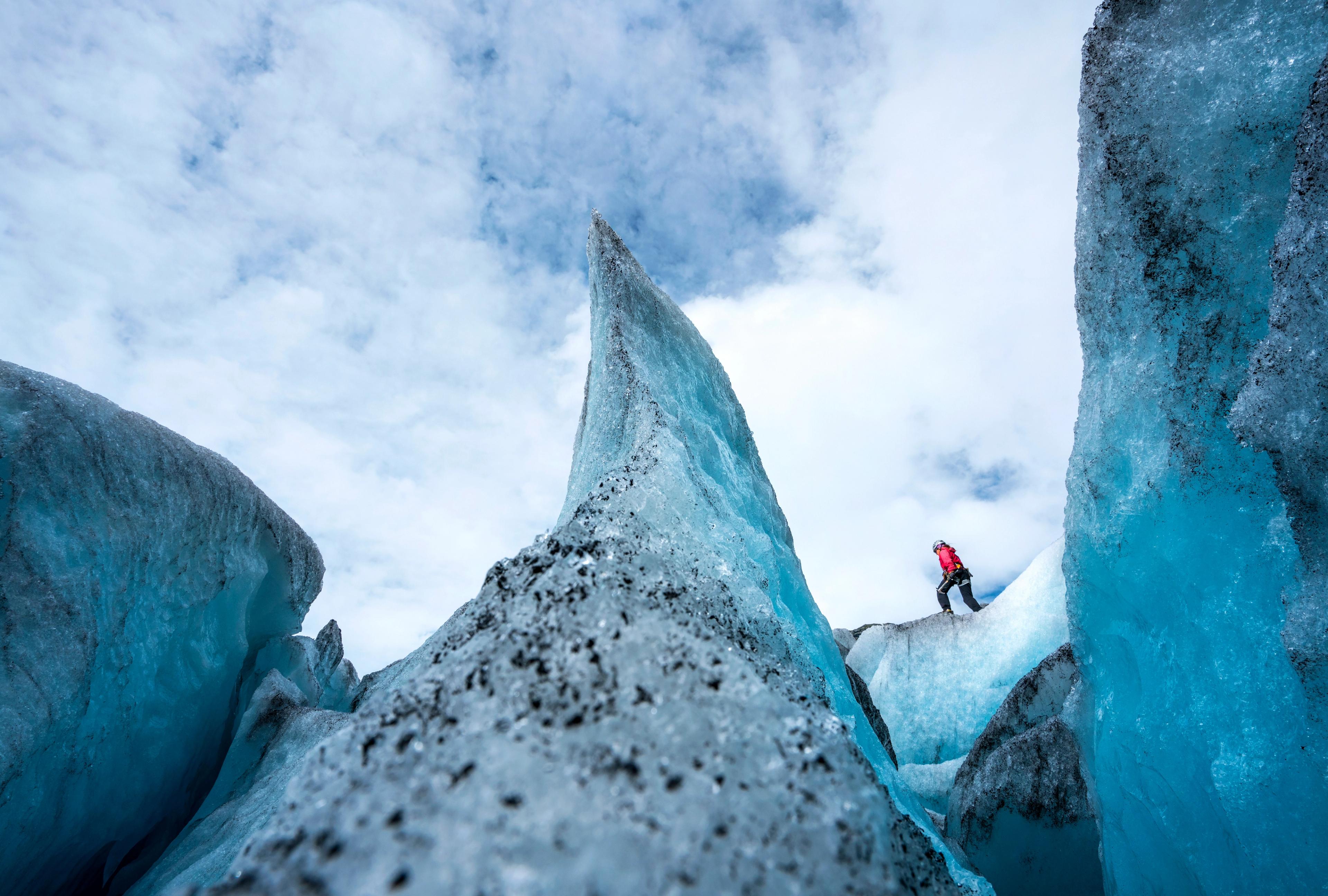 A person is hiking on the Nigardsbreen glacier in the Jostedalen valley in the Sognefjord area of Fjord Norway