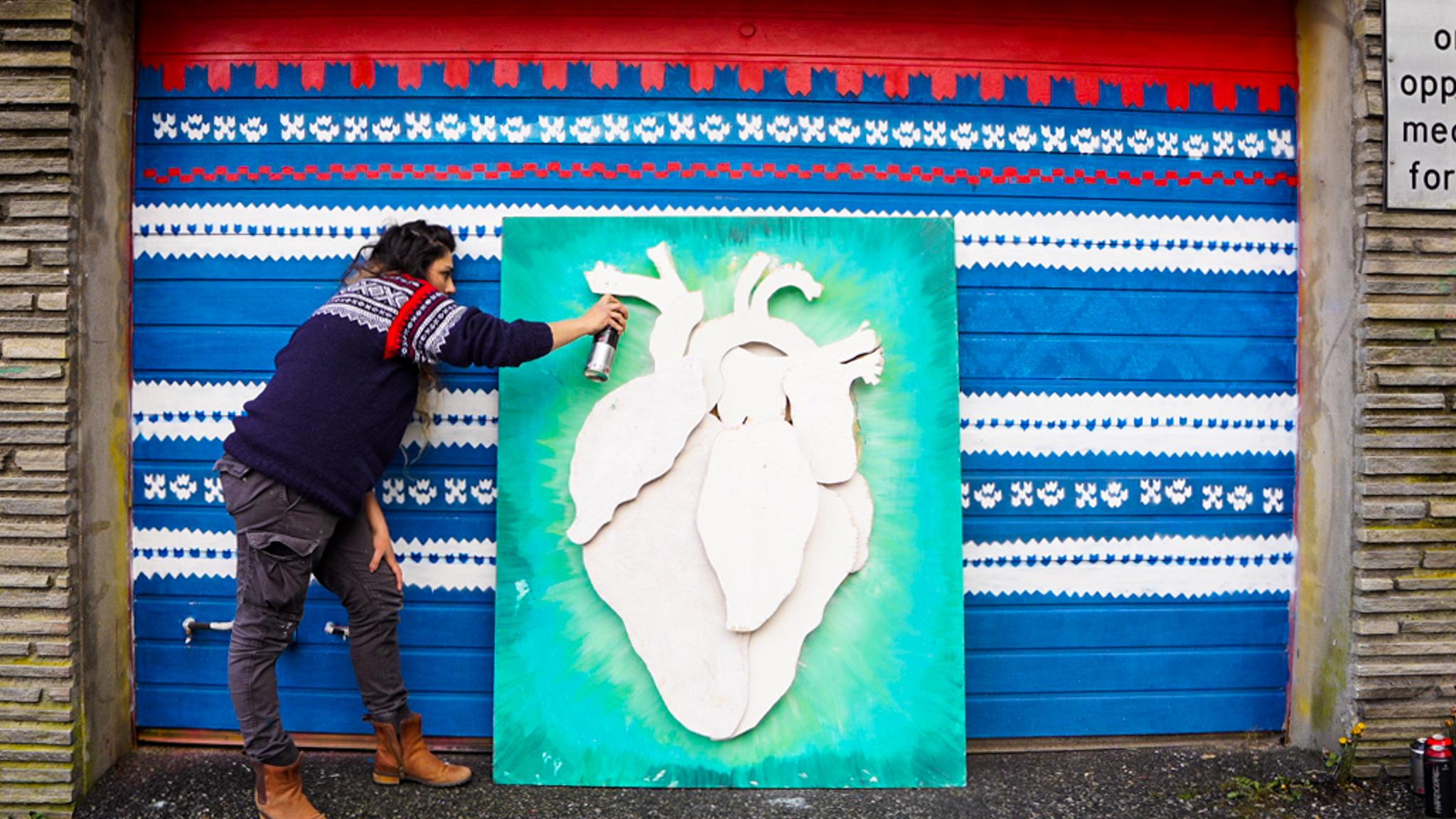 A artist making street art in Stavanger, Fjord Norway.