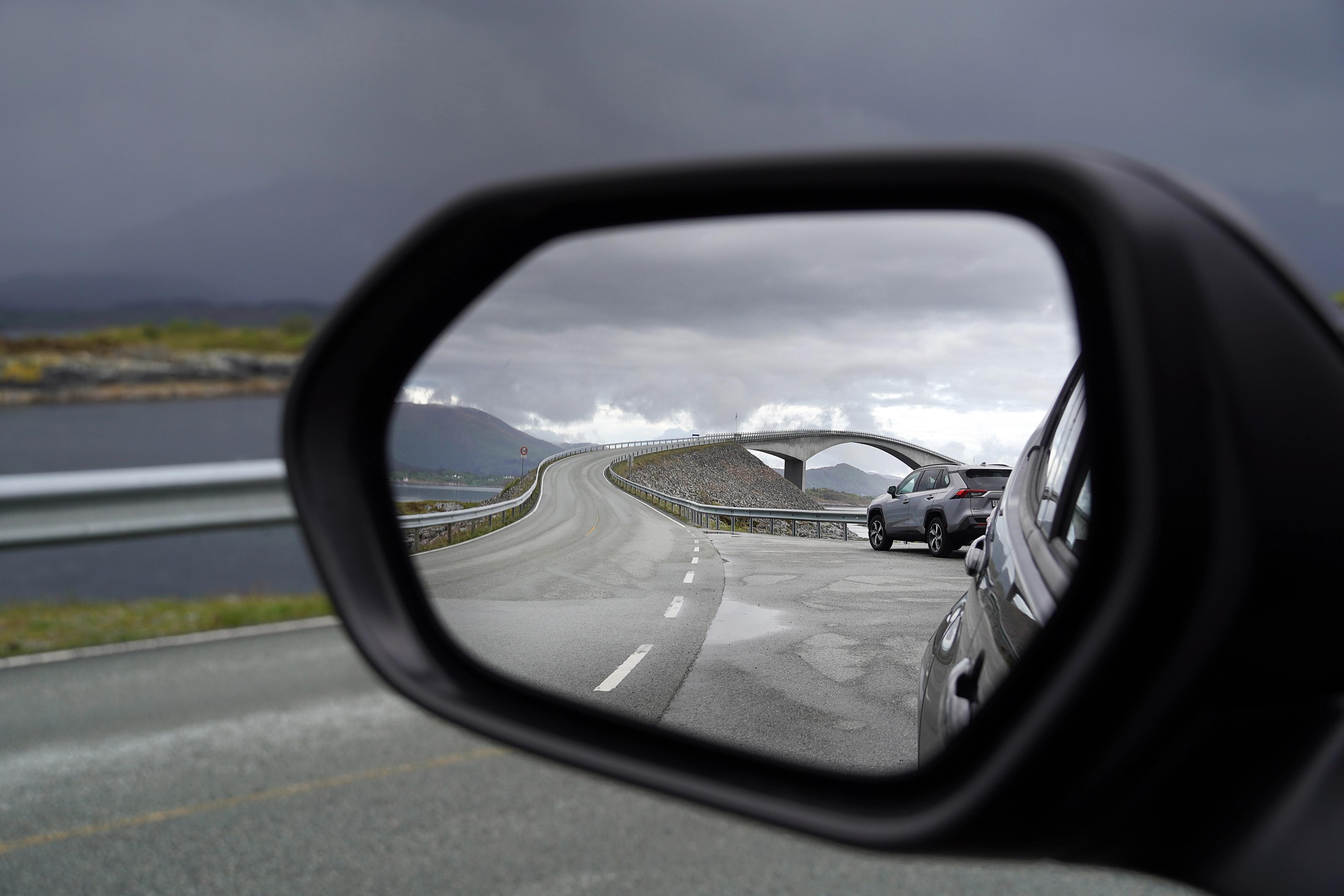 The bridge of the Atlantic road reflected in a car mirror