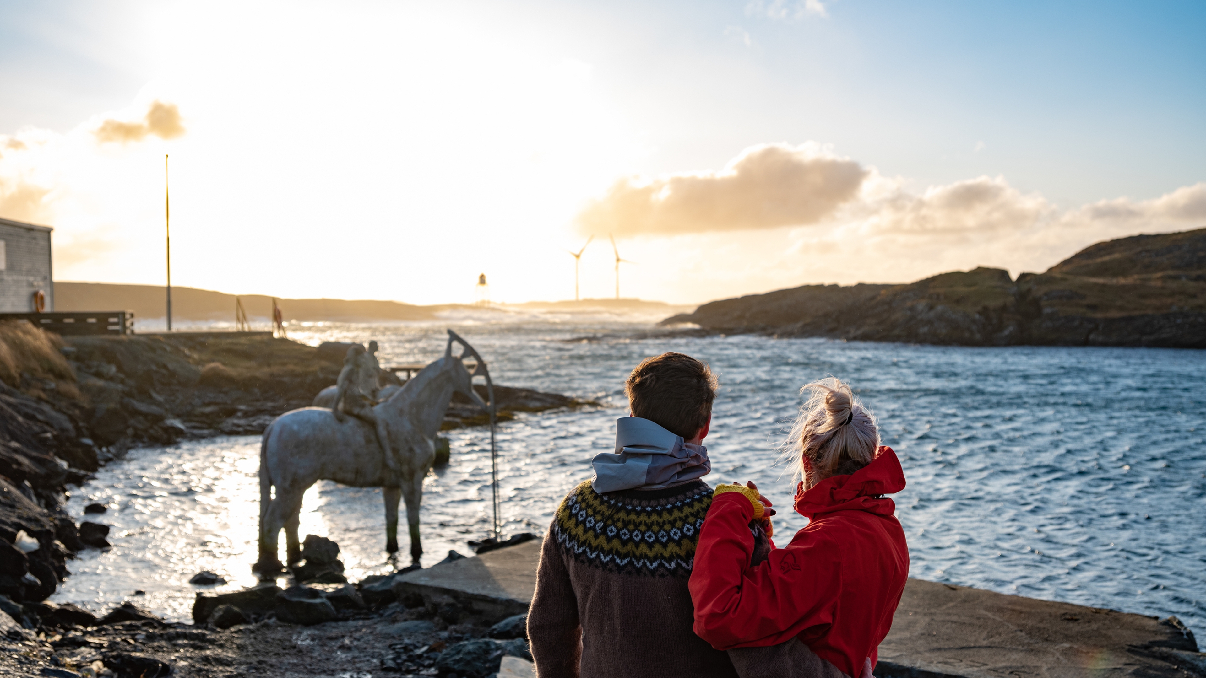 Two people watching the rising tide, in Haugesund