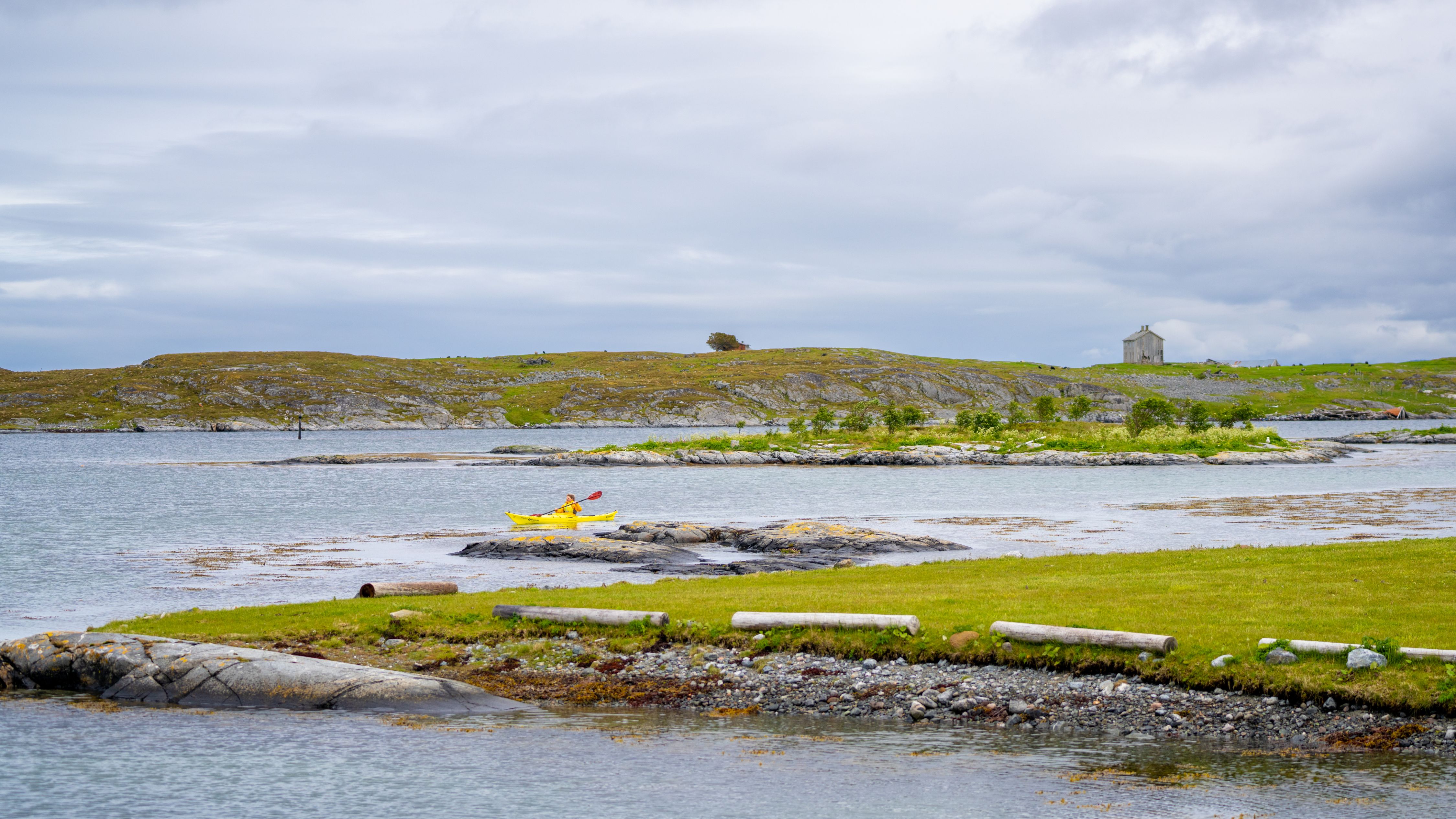 A woman kayaking in the archipelago at Smøla in Nordmøre