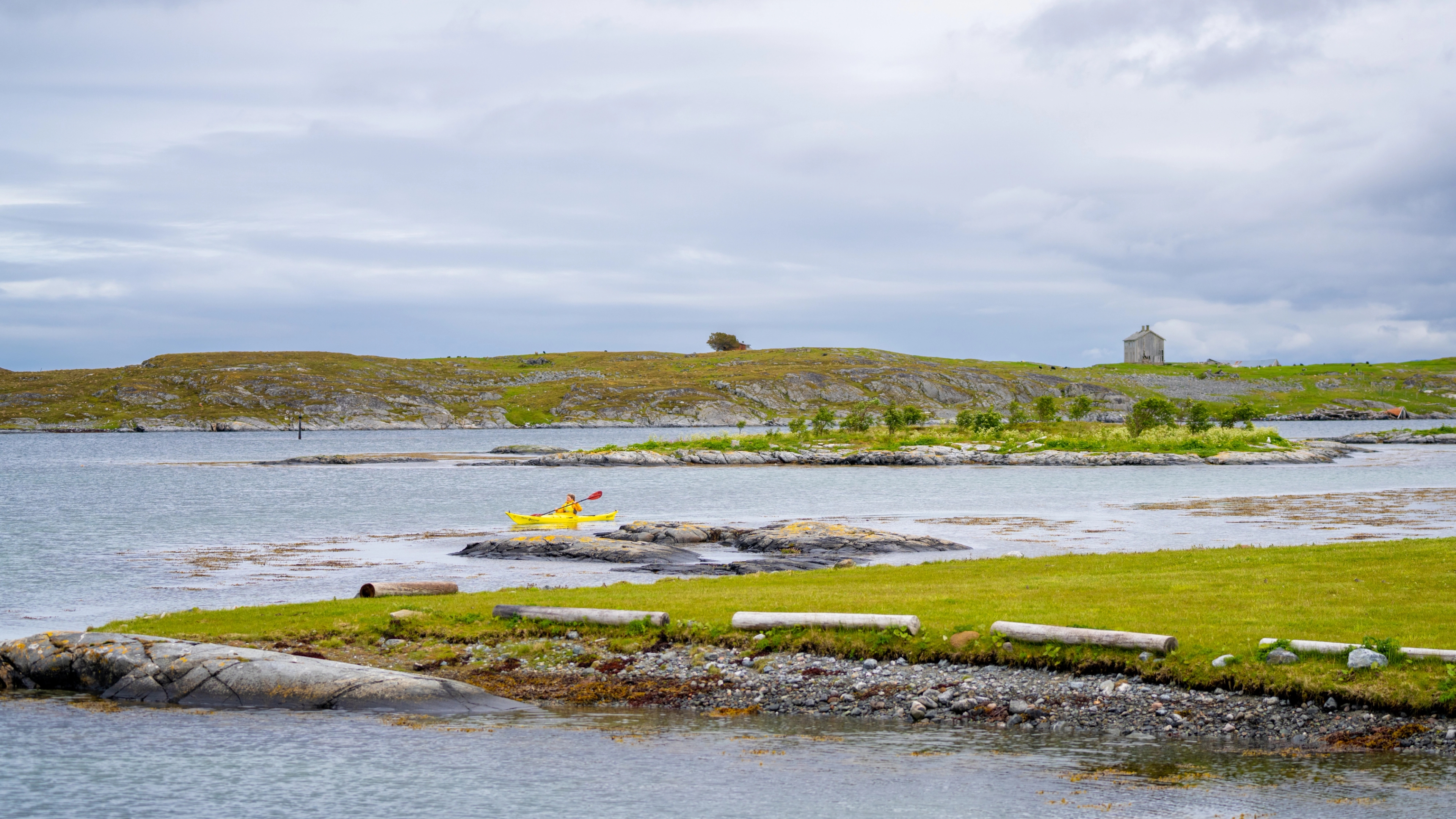 A woman kayaking in the archipelago at Smøla in Nordmøre