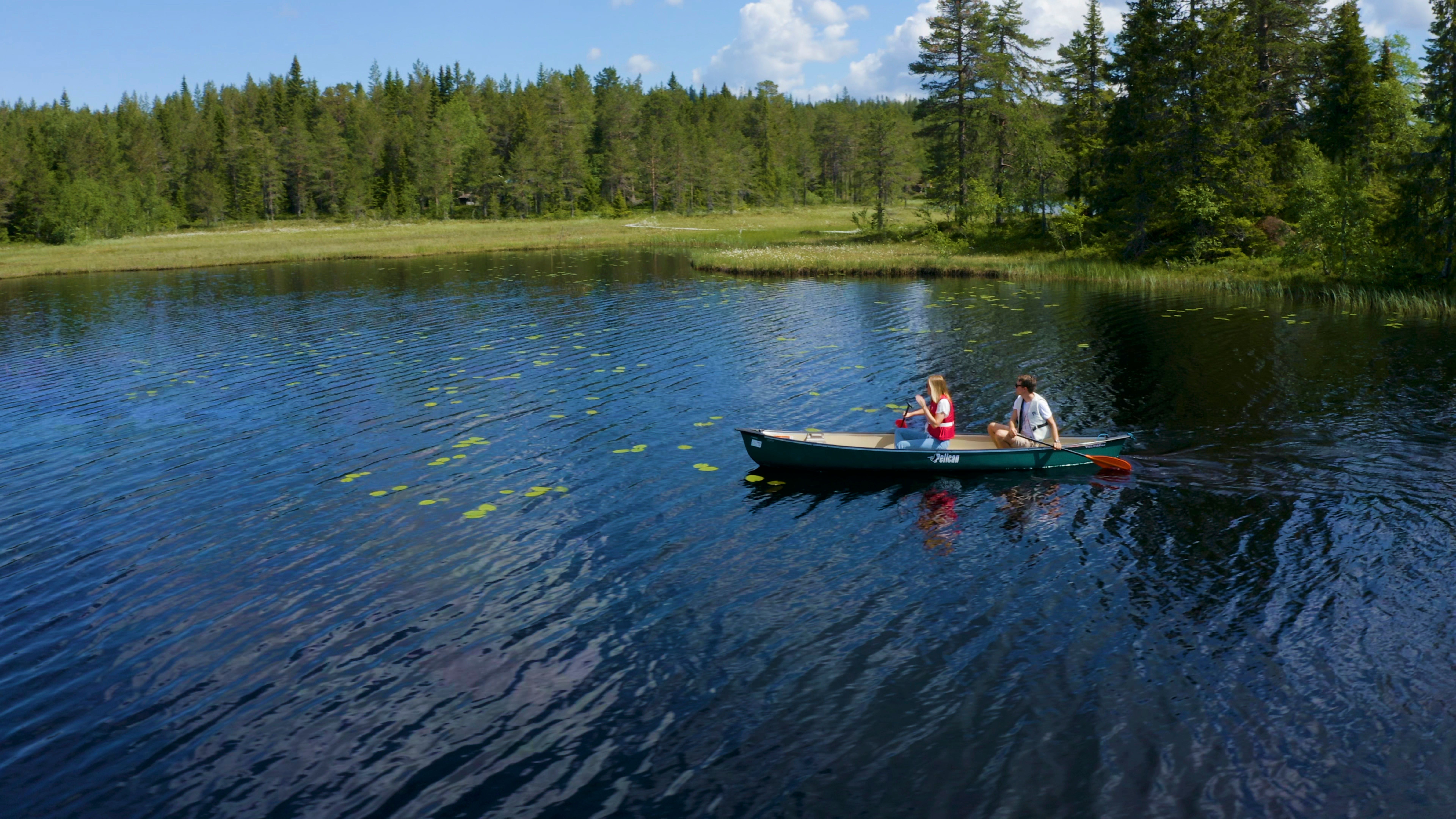 Two people canoeing in Lygna, Gran, Eastern Norway