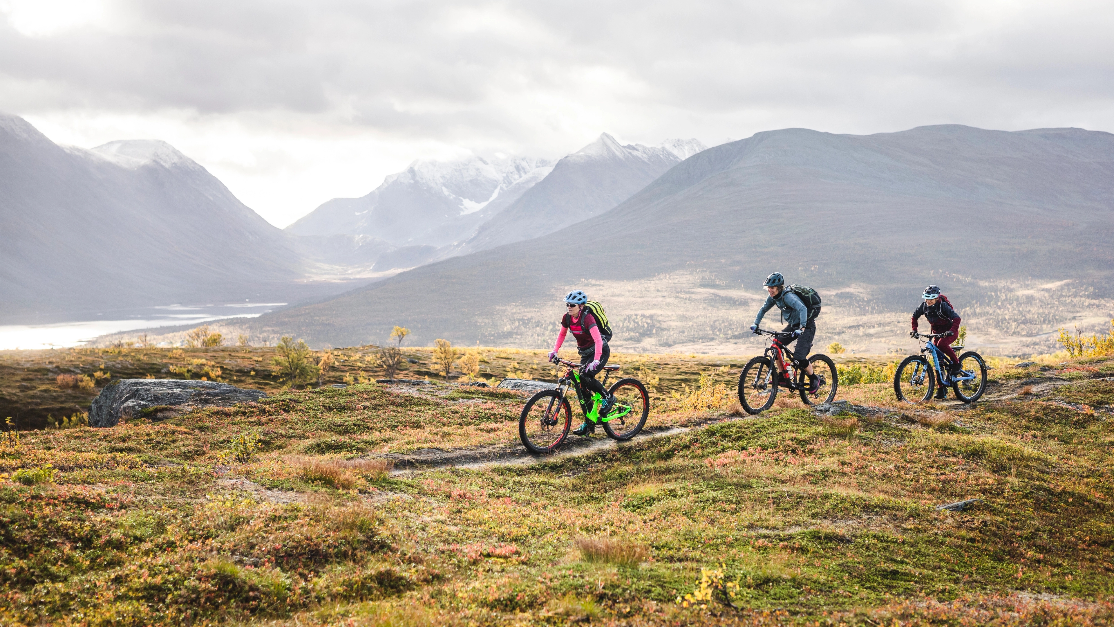 Three people biking in The Lyngenfjord