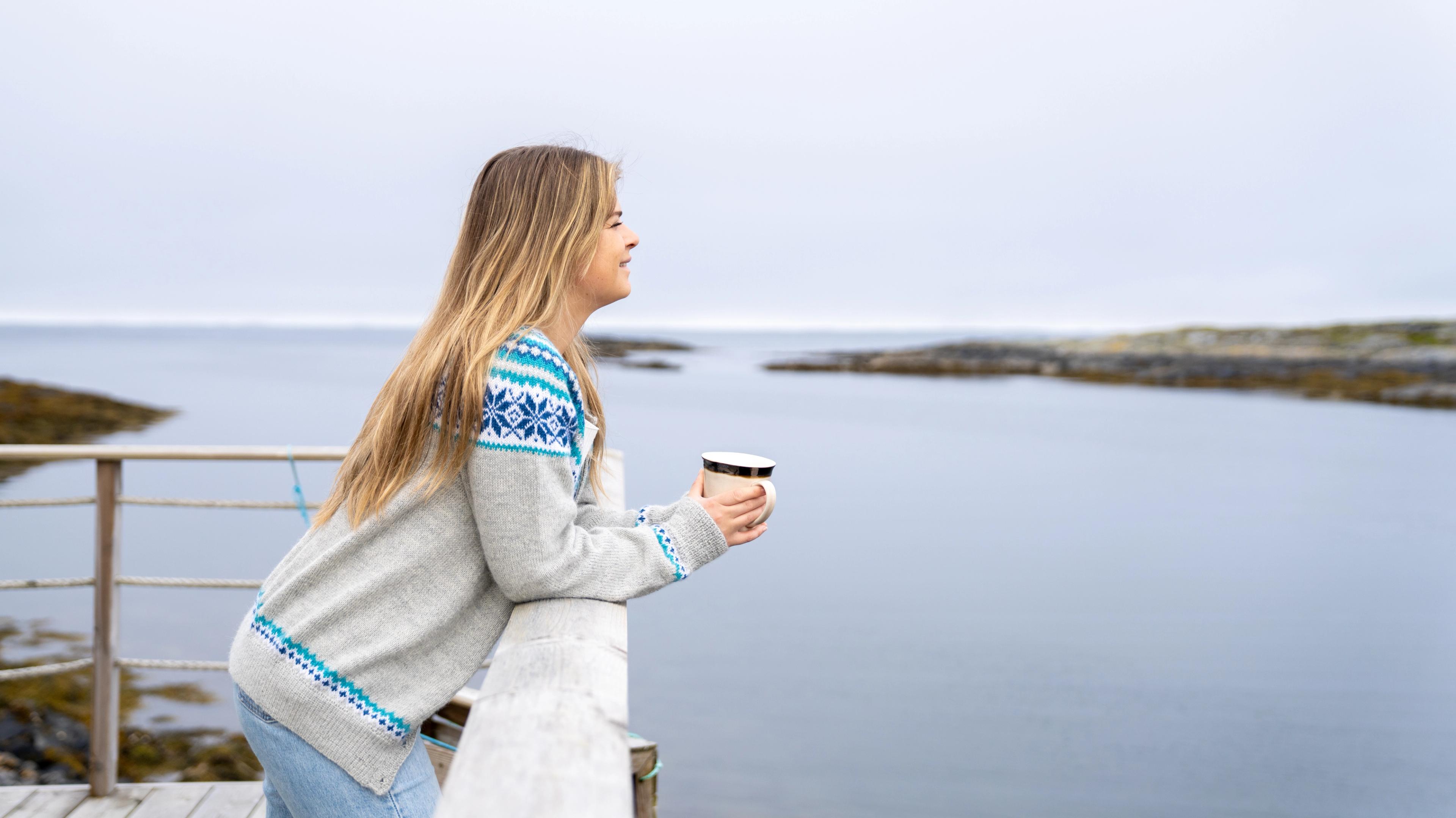 Enjoying a cup of coffee at Olsen Naustet, Fjord Norway