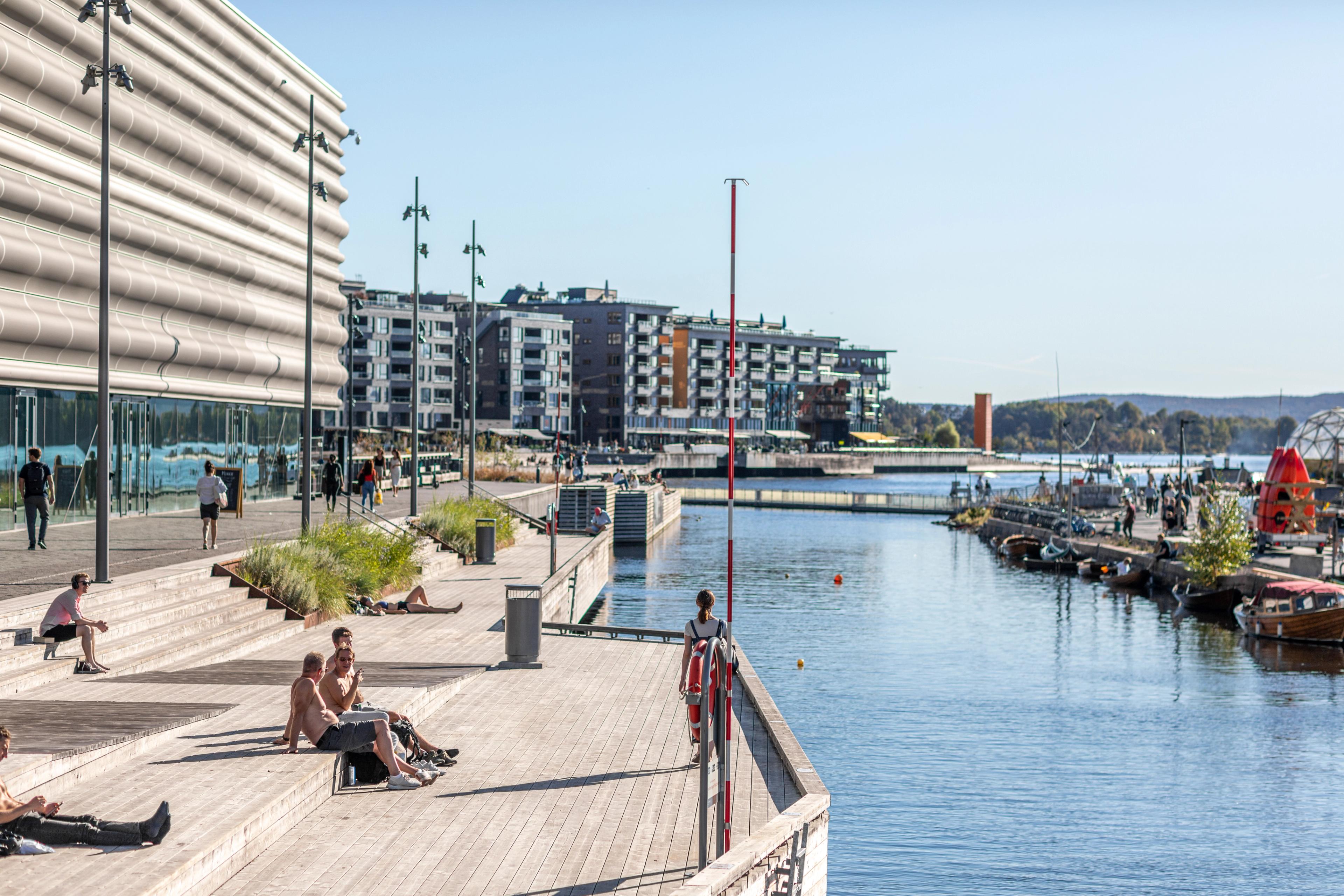 People hanging out at The Munch pier