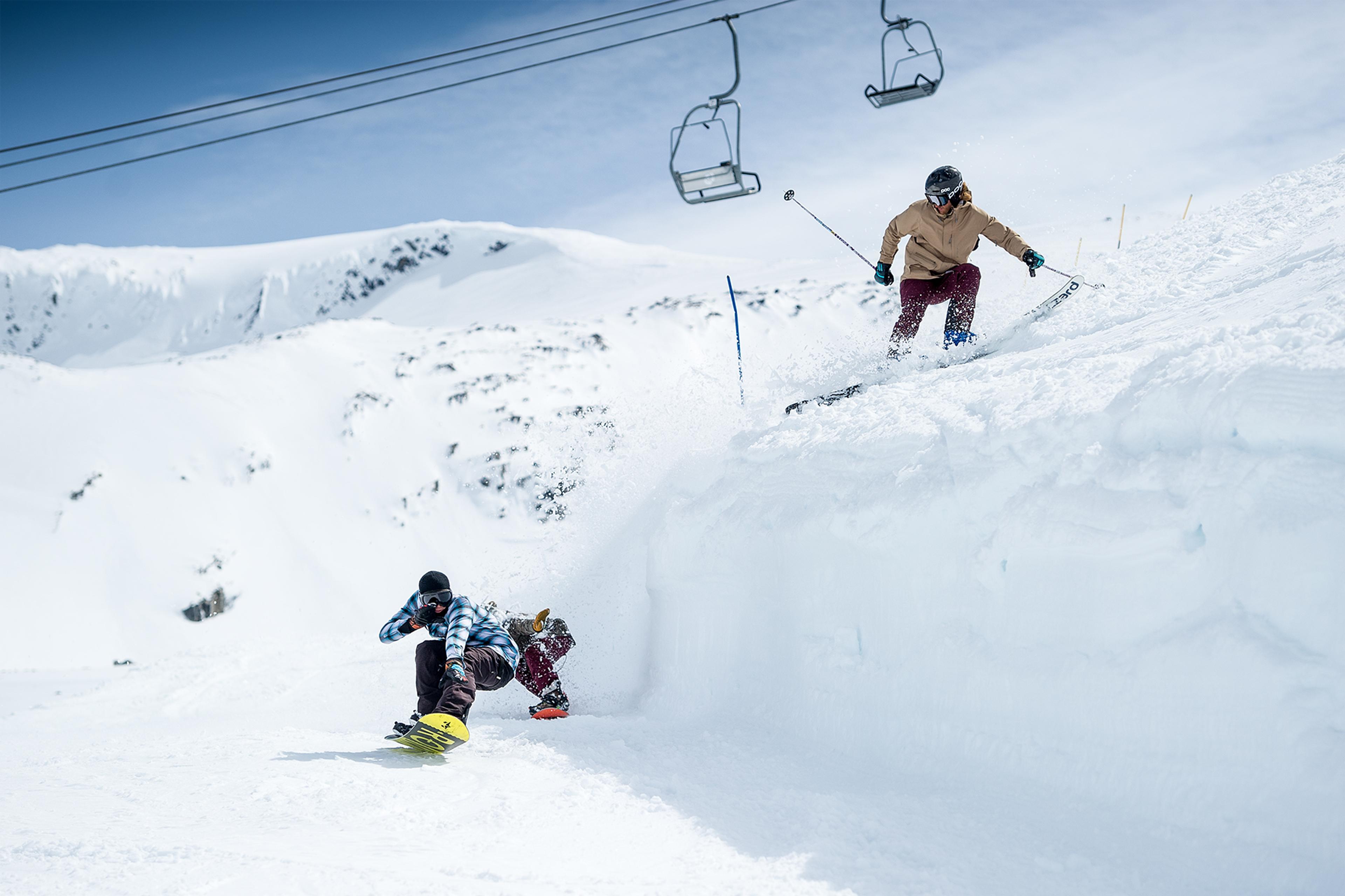 People snowboarding and skiing at Stryn summer ski resort in Fjord Norway