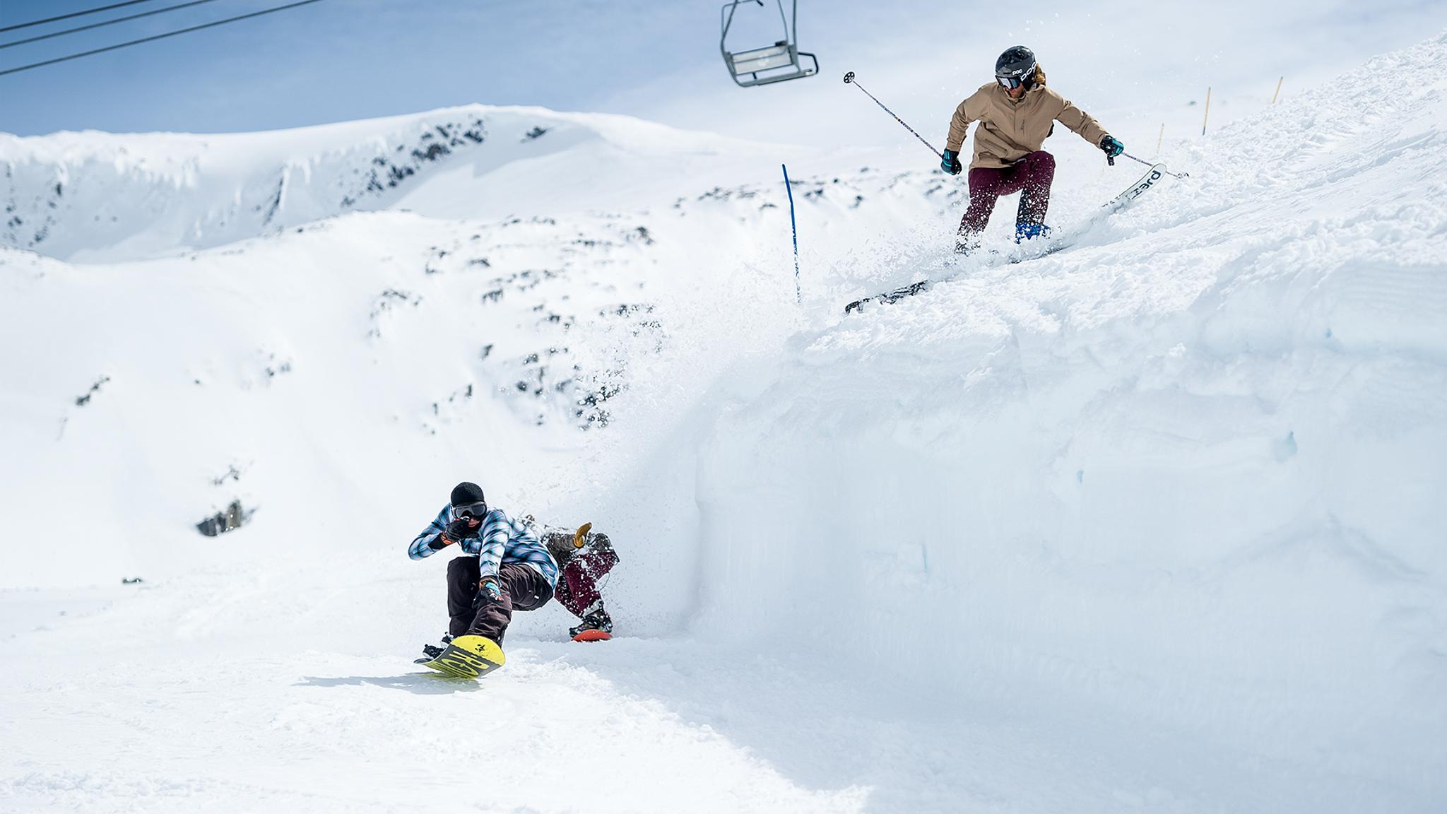 People snowboarding and skiing at Stryn summer ski resort in Fjord Norway