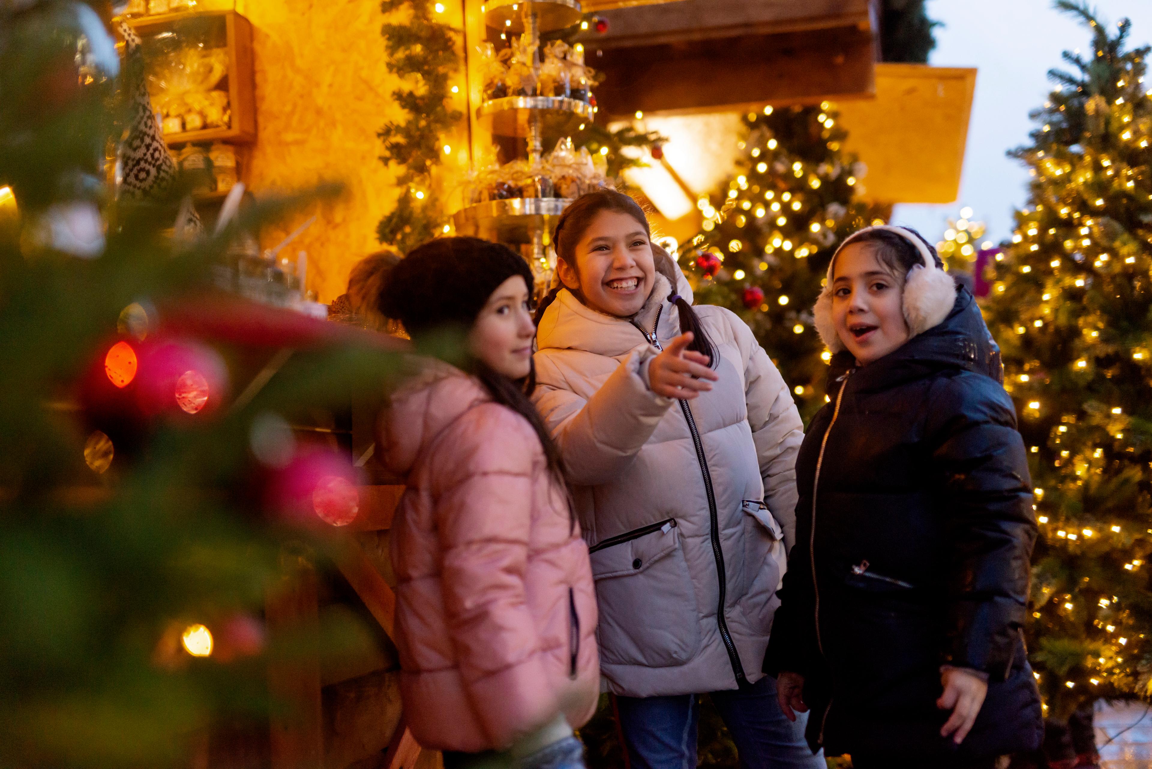 Three girls at a Christmas market in Kristiansand, Southern Norway