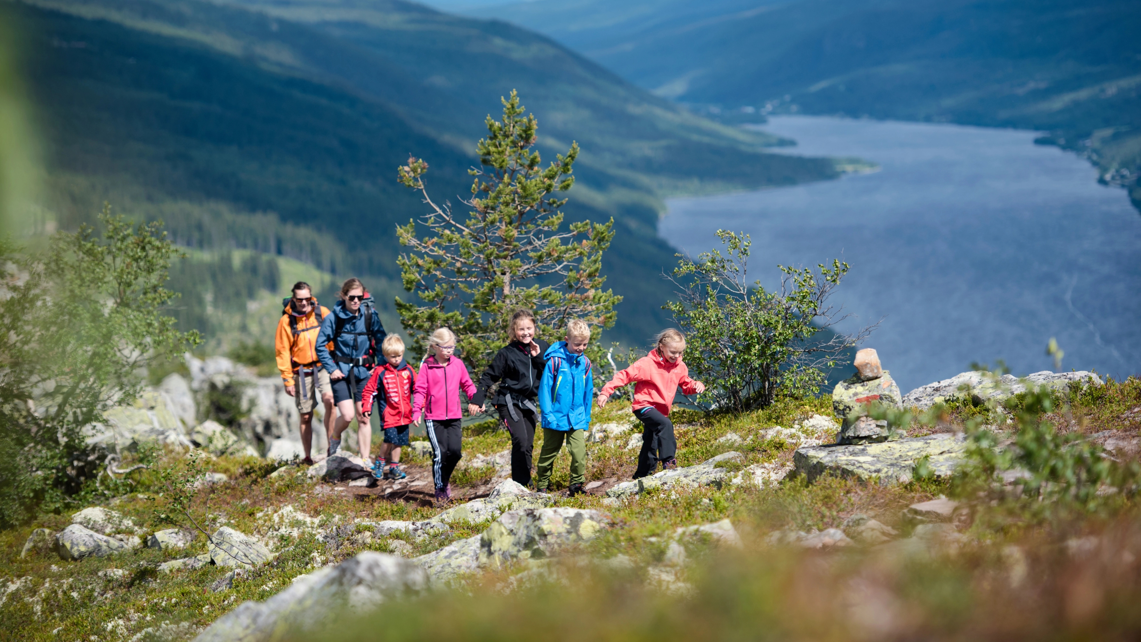 A family is hiking the round trip to mount Skagsvola in Trysil, Eastern Norway