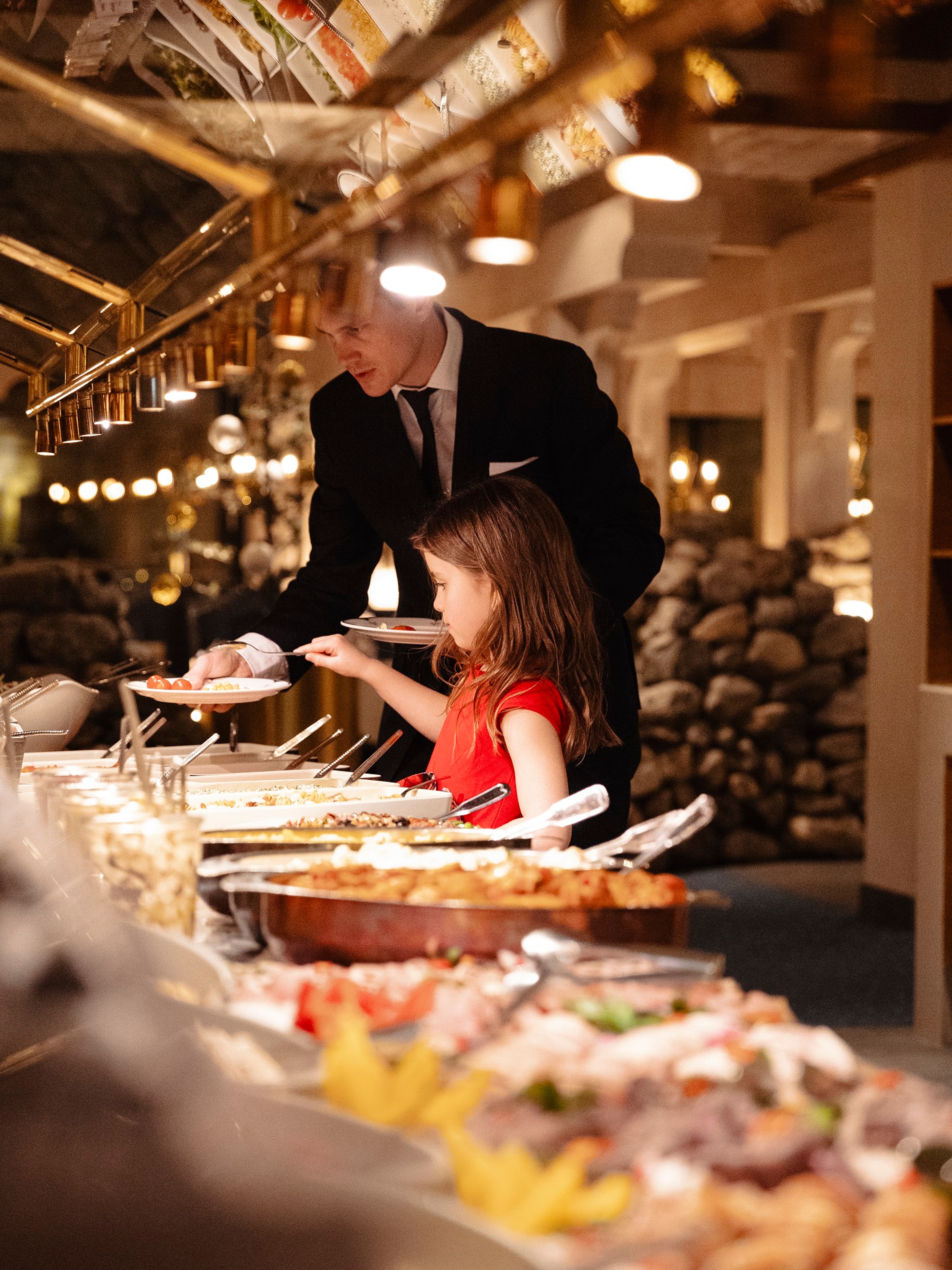 A girl at a dinner buffet at Hotel Alexandra in Loen