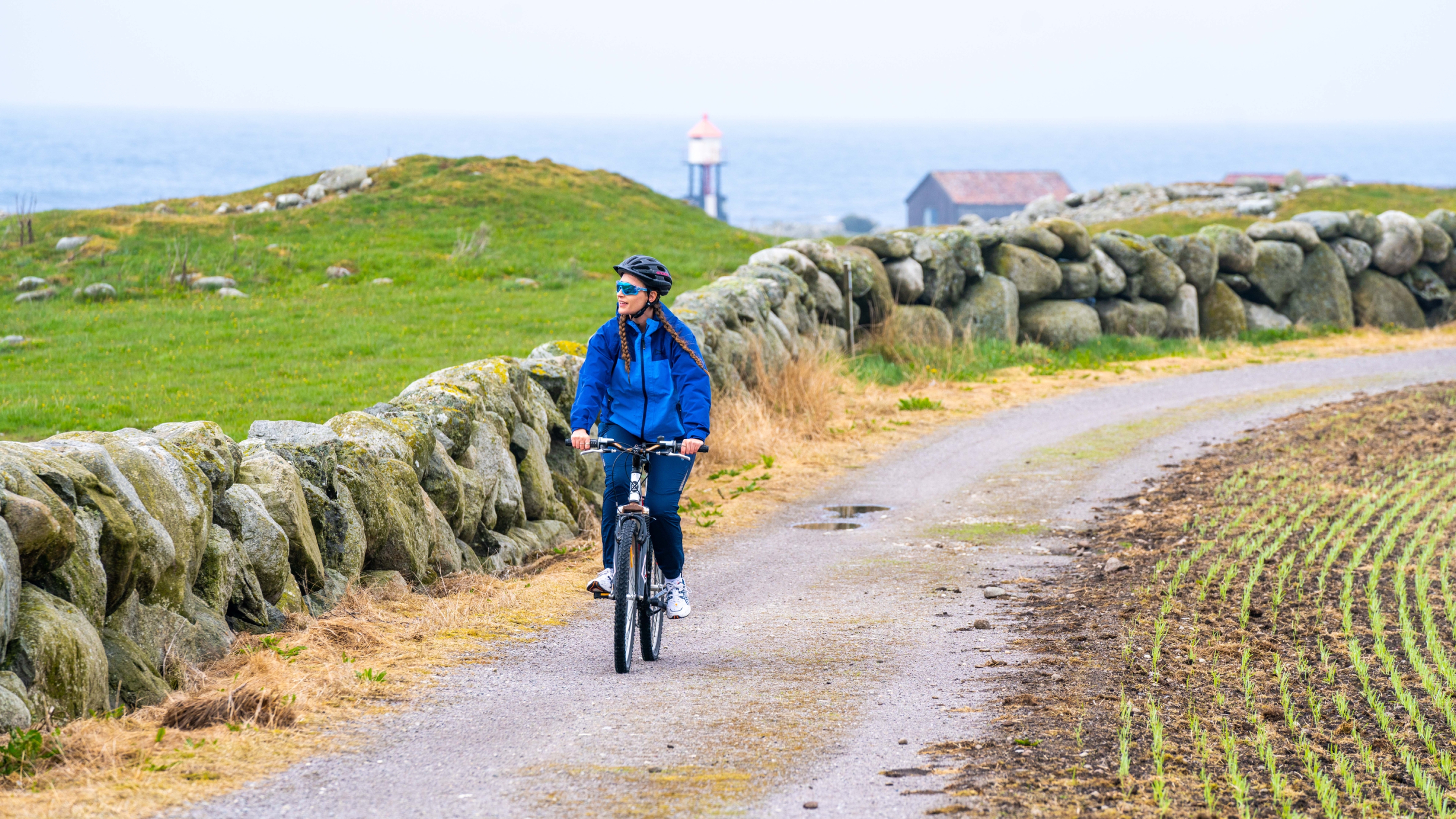 A woman cycling at Jæren in Norway