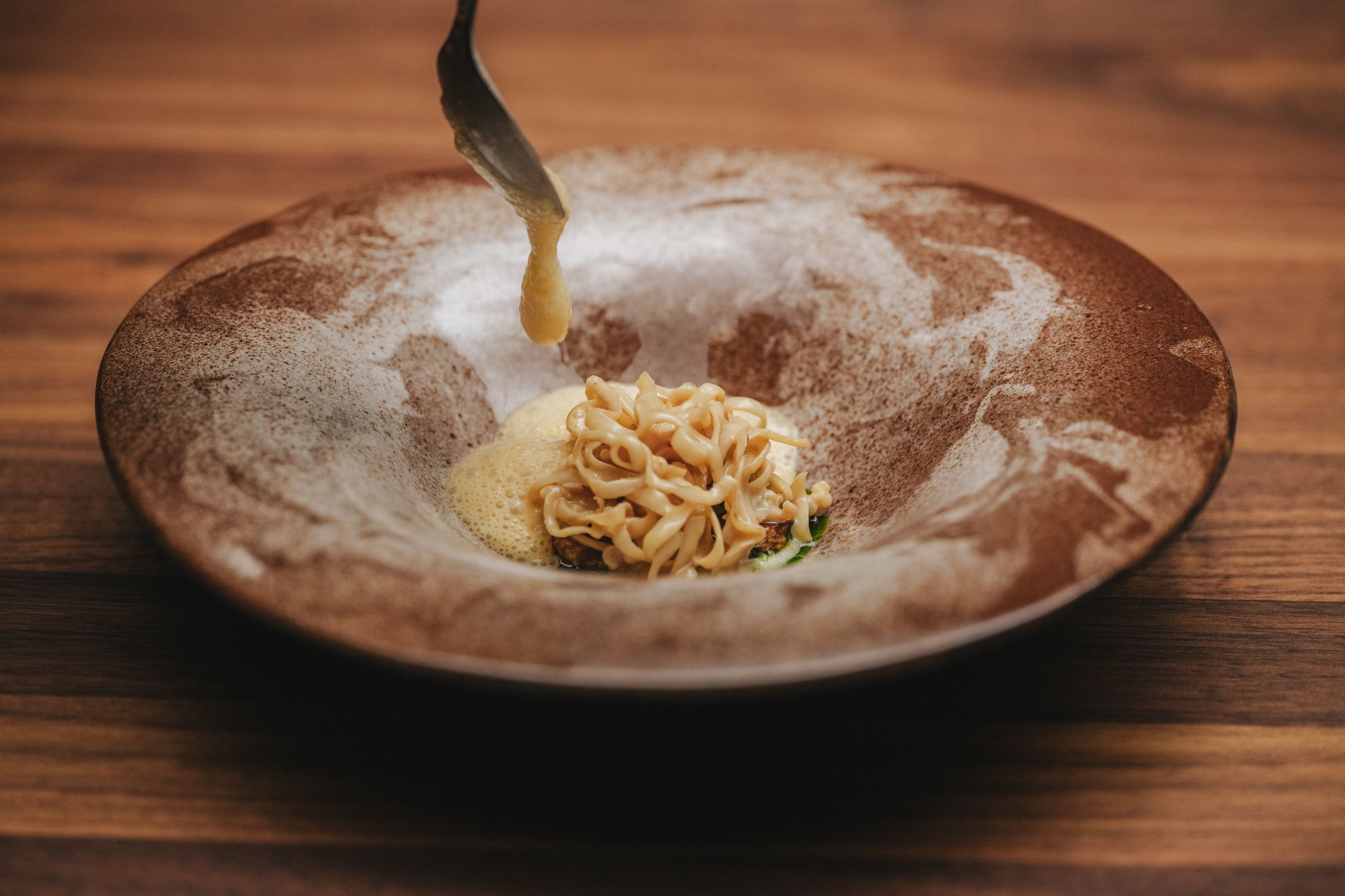 Food on a plate at the Iris restaurant at The Salmon Eye in Hardanger