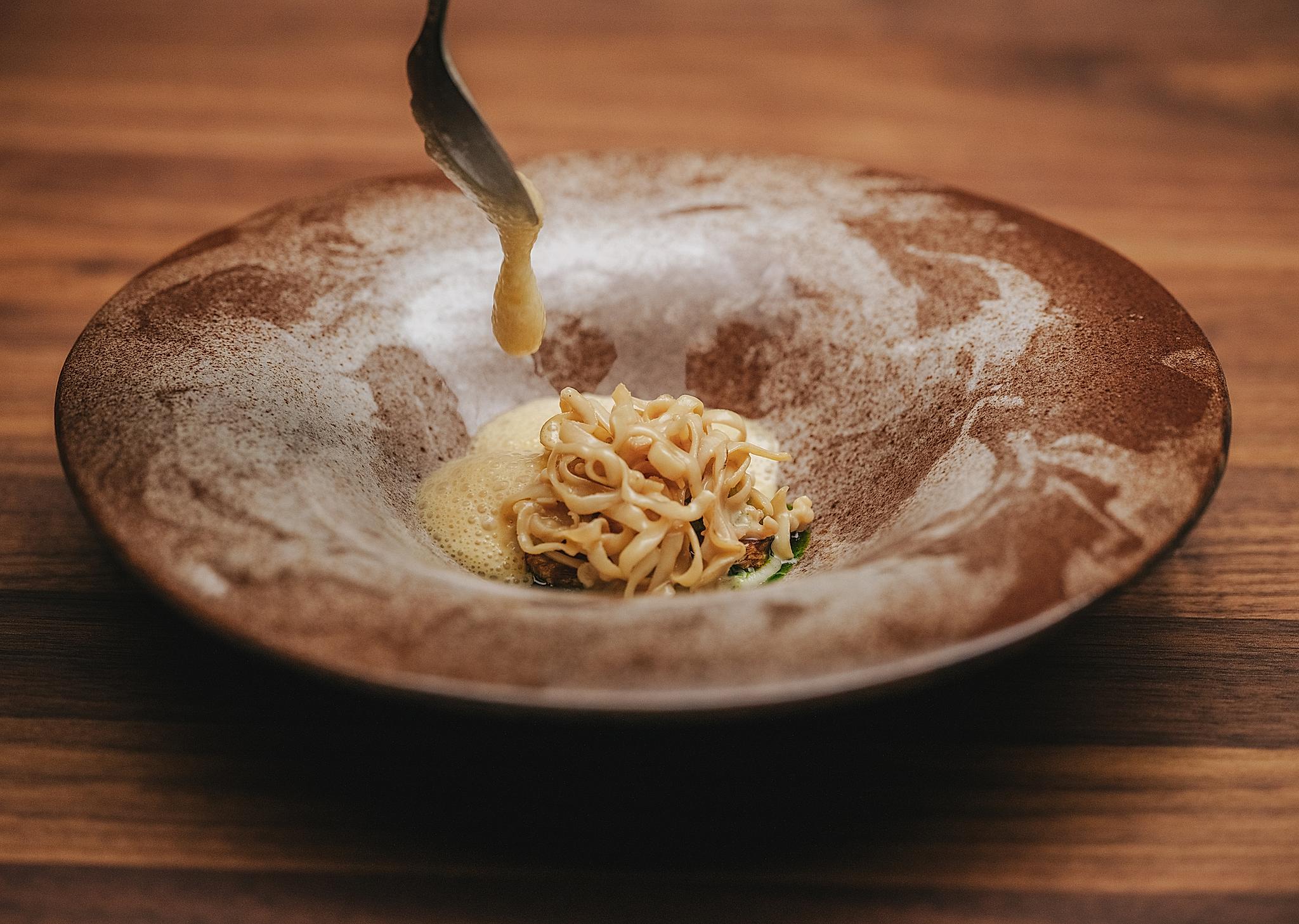 Food on a plate at the Iris restaurant at The Salmon Eye in Hardanger