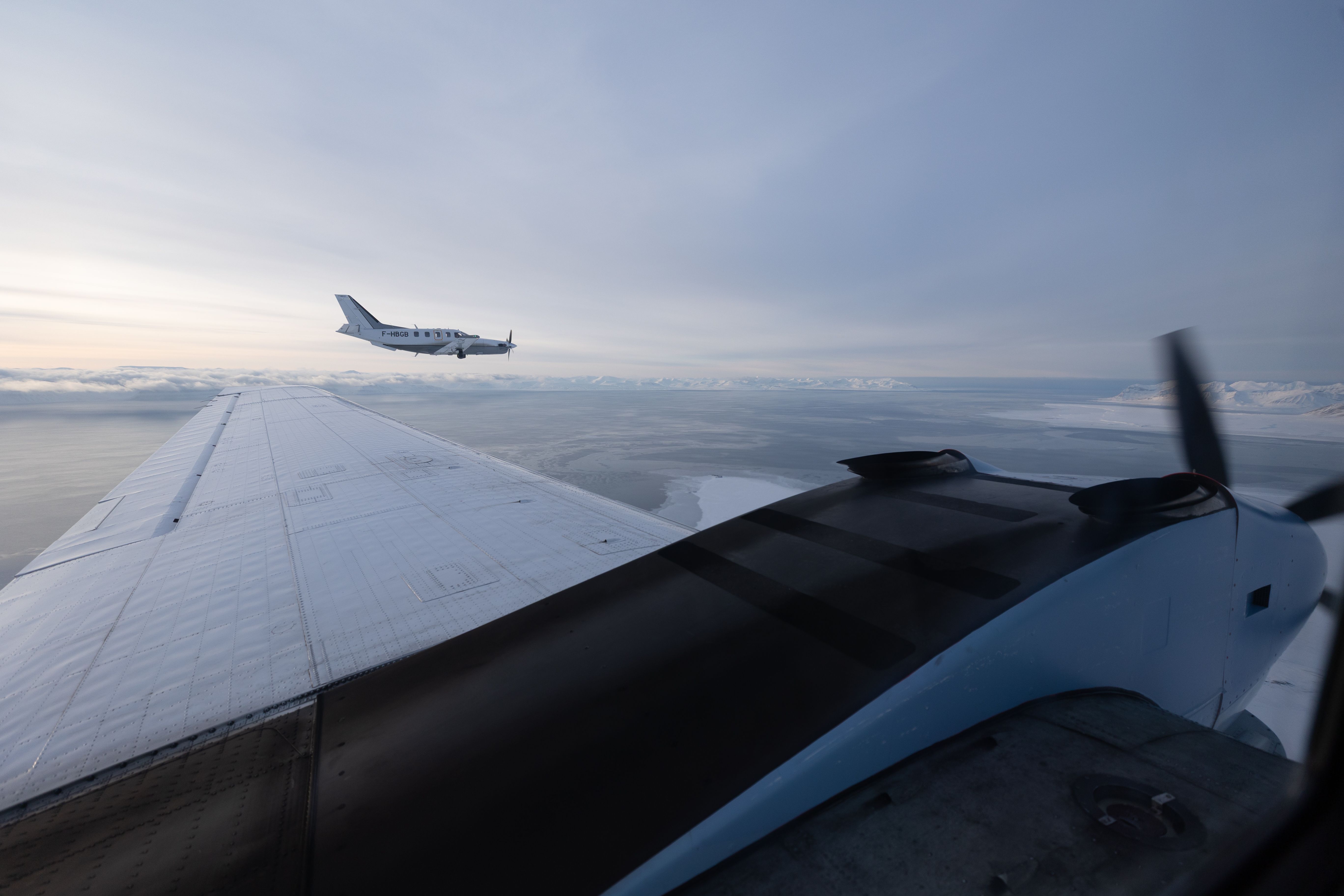 Small planes flying over Svalbard