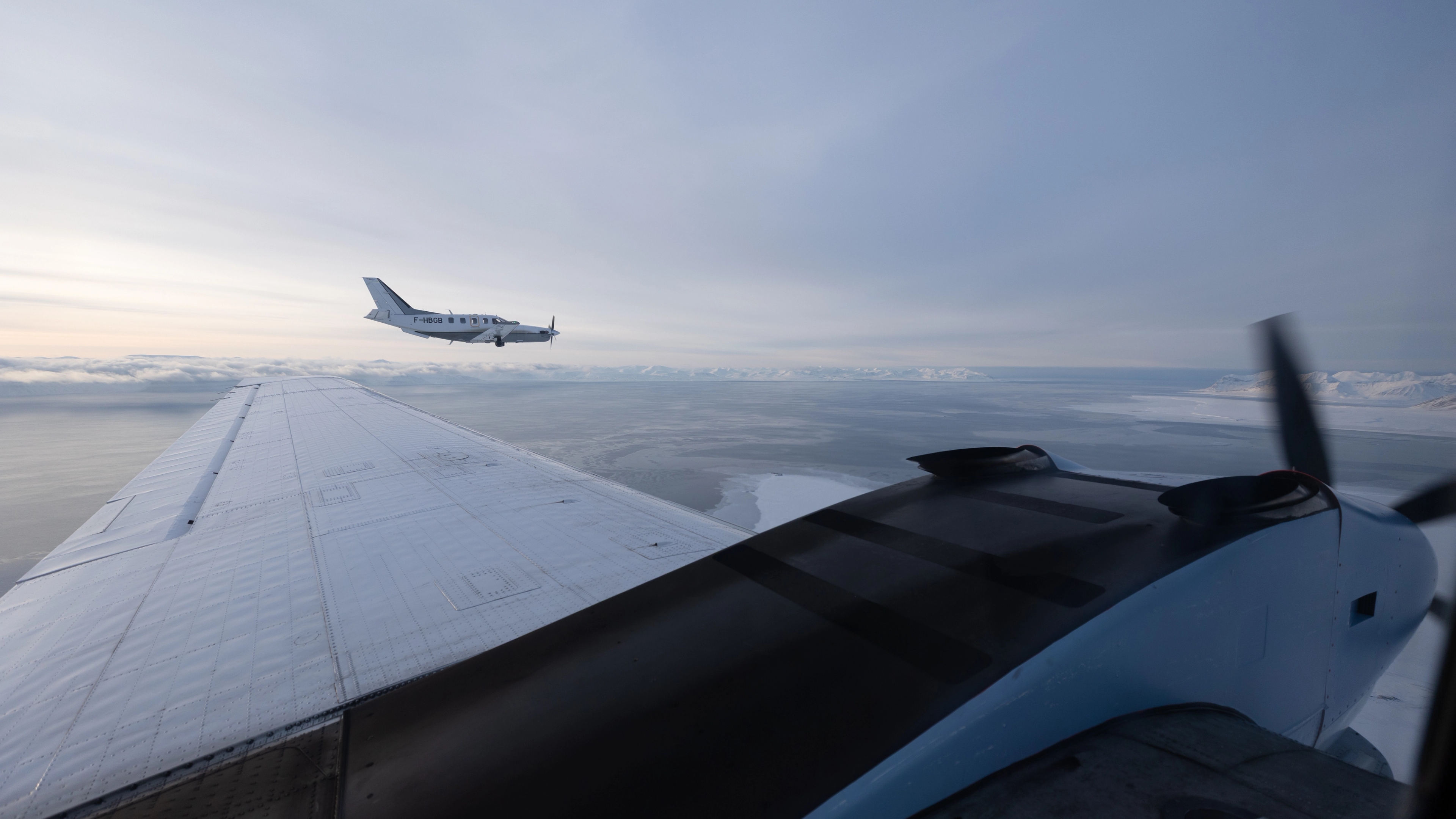 Small planes flying over Svalbard