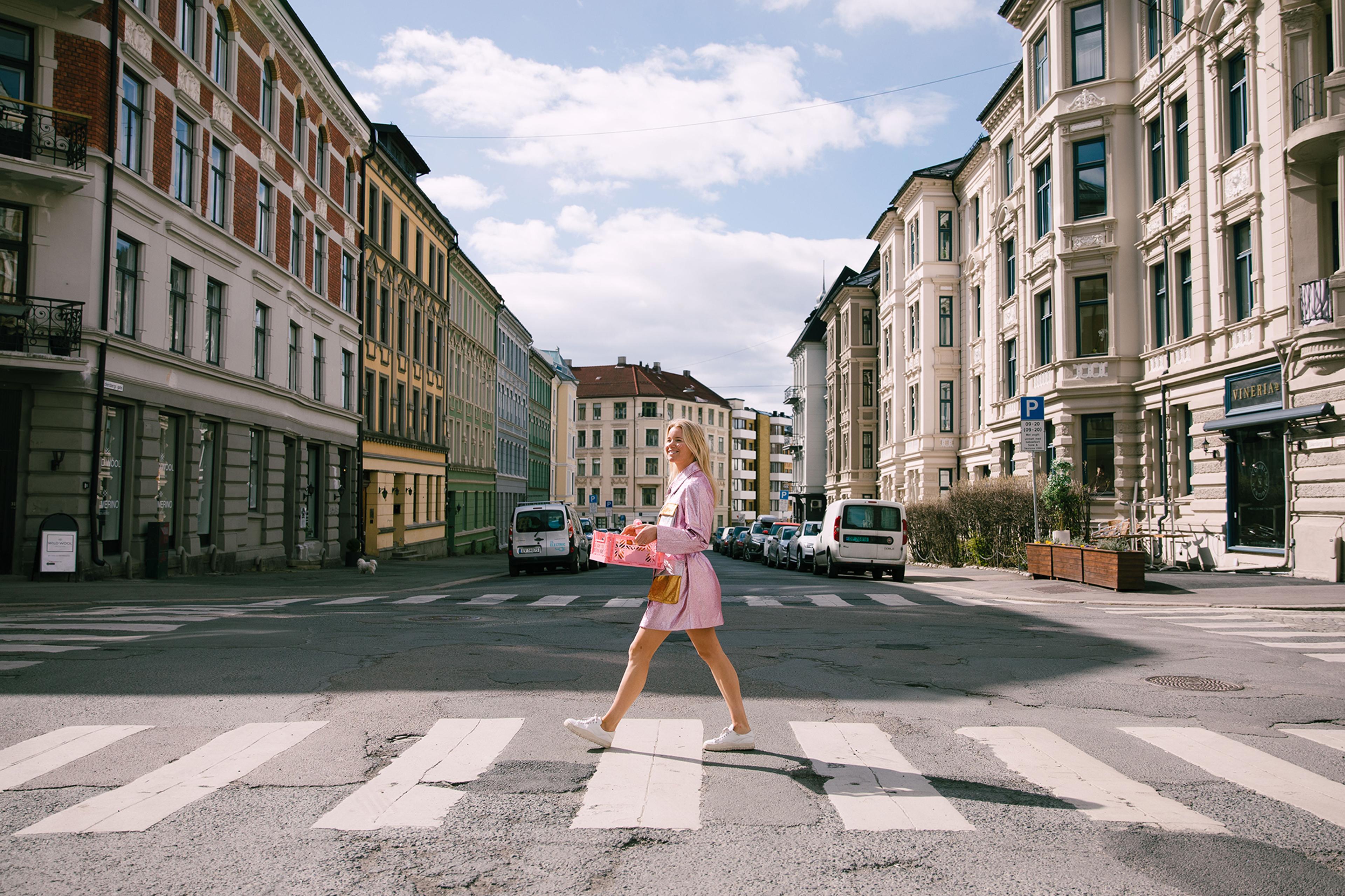 A woman with cinammon buns from Skillings in the streets of Oslo, Eastern Norway