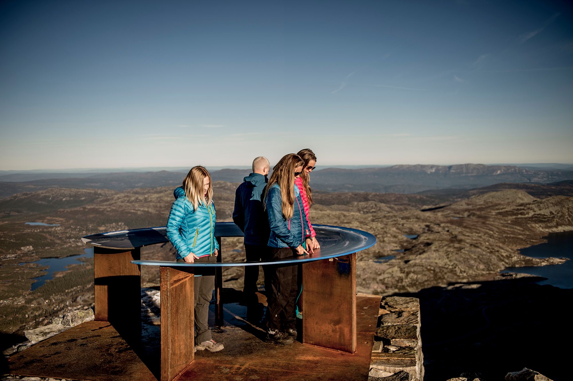 People enjoying the view from Mount Gaustatoppen in Telemark, Norway