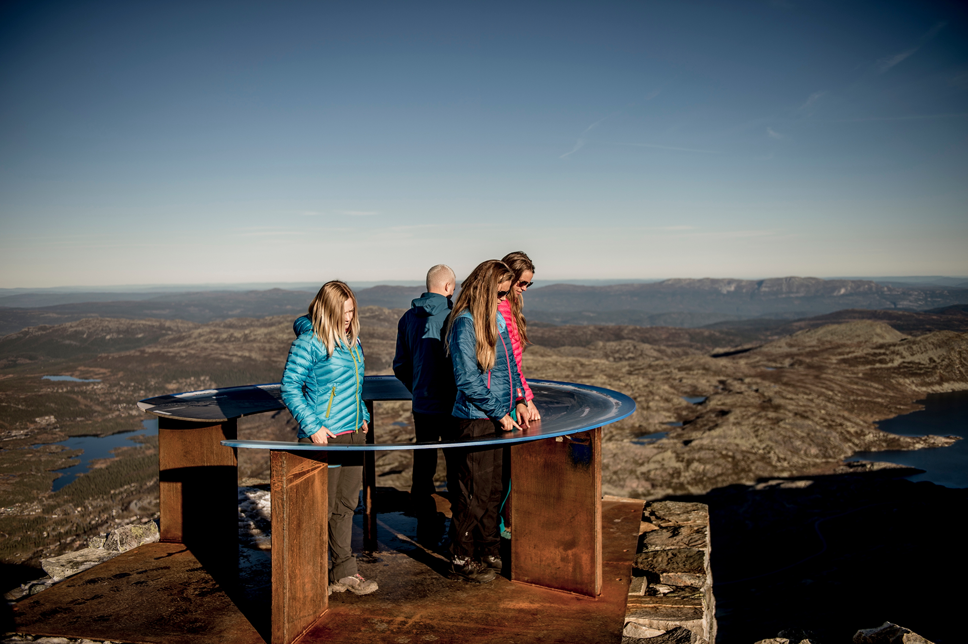 People enjoying the view from Mount Gaustatoppen in Telemark, Norway