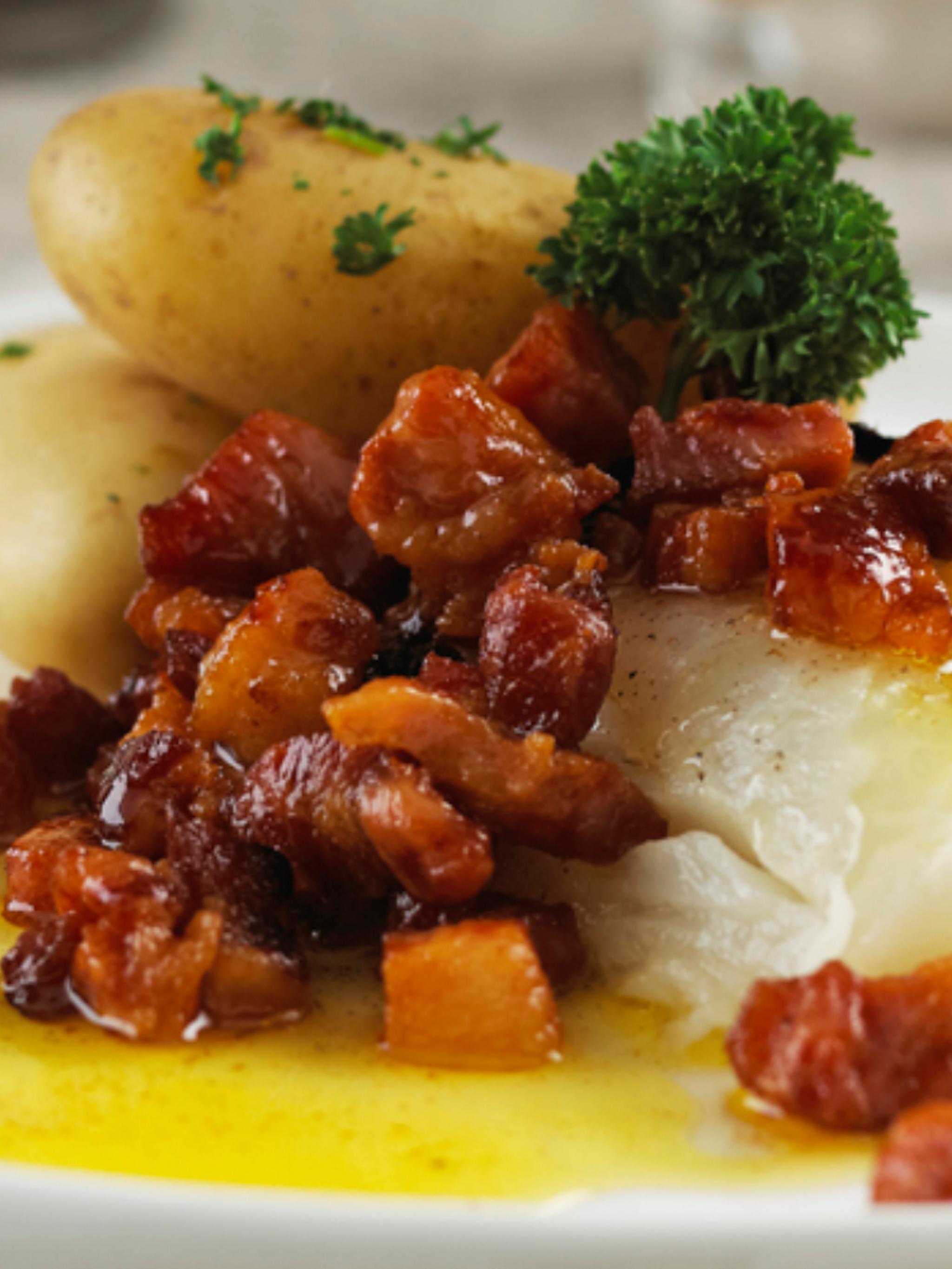 A serving of lutefisk with bacon and potatoes