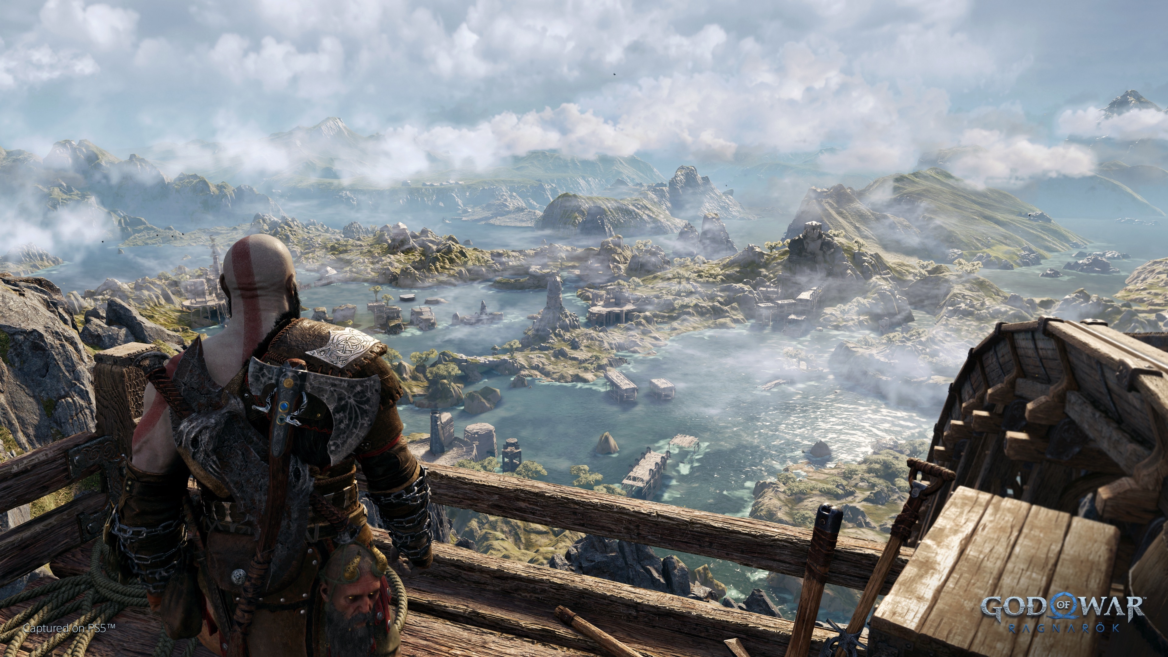 A picture from the game God of War Ragnarök, with a view over the Scandinavian inspired landscape