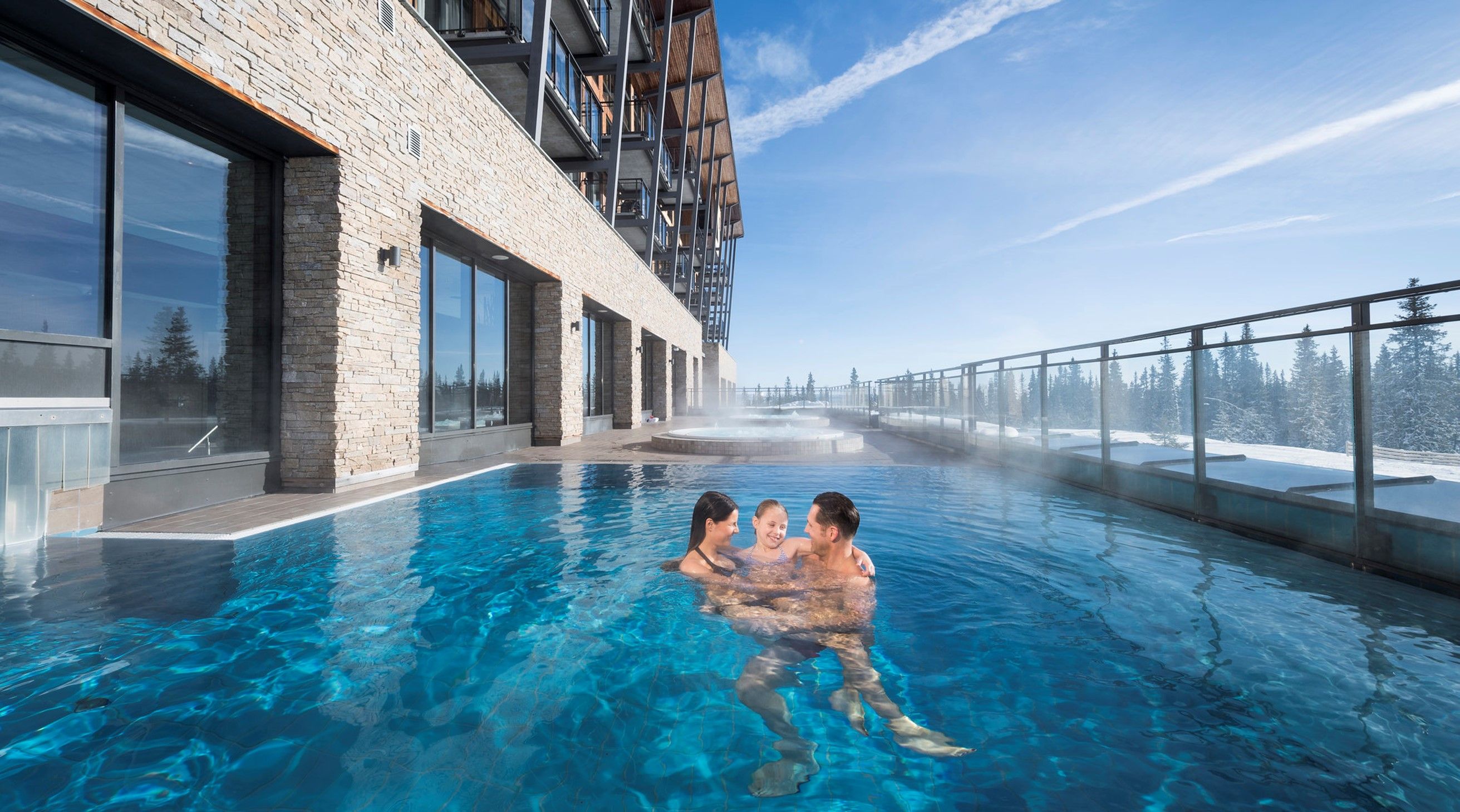 Family enjoying the pool at SkiStar Lodge Trysil