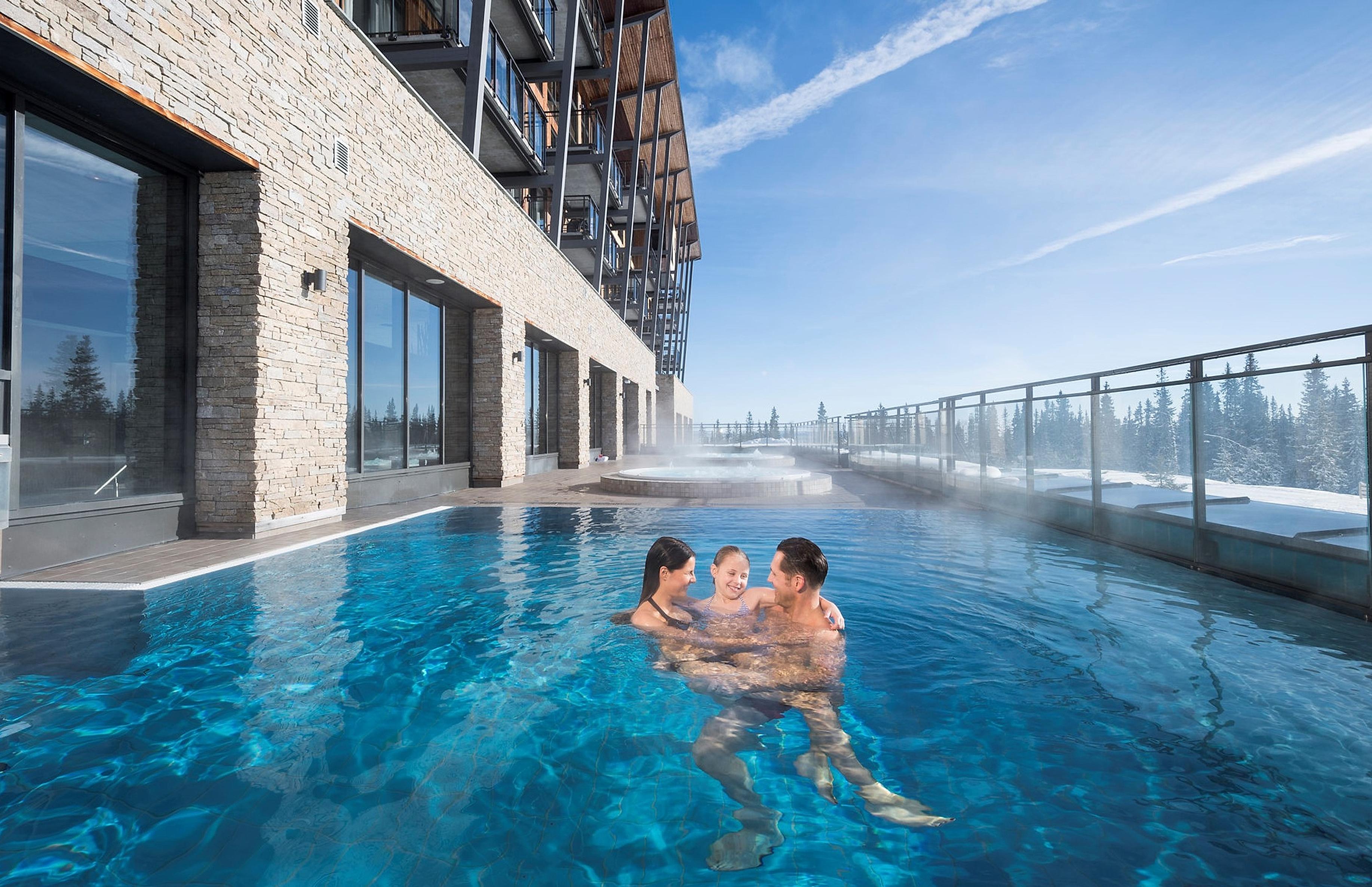 Family enjoying the pool at SkiStar Lodge Trysil