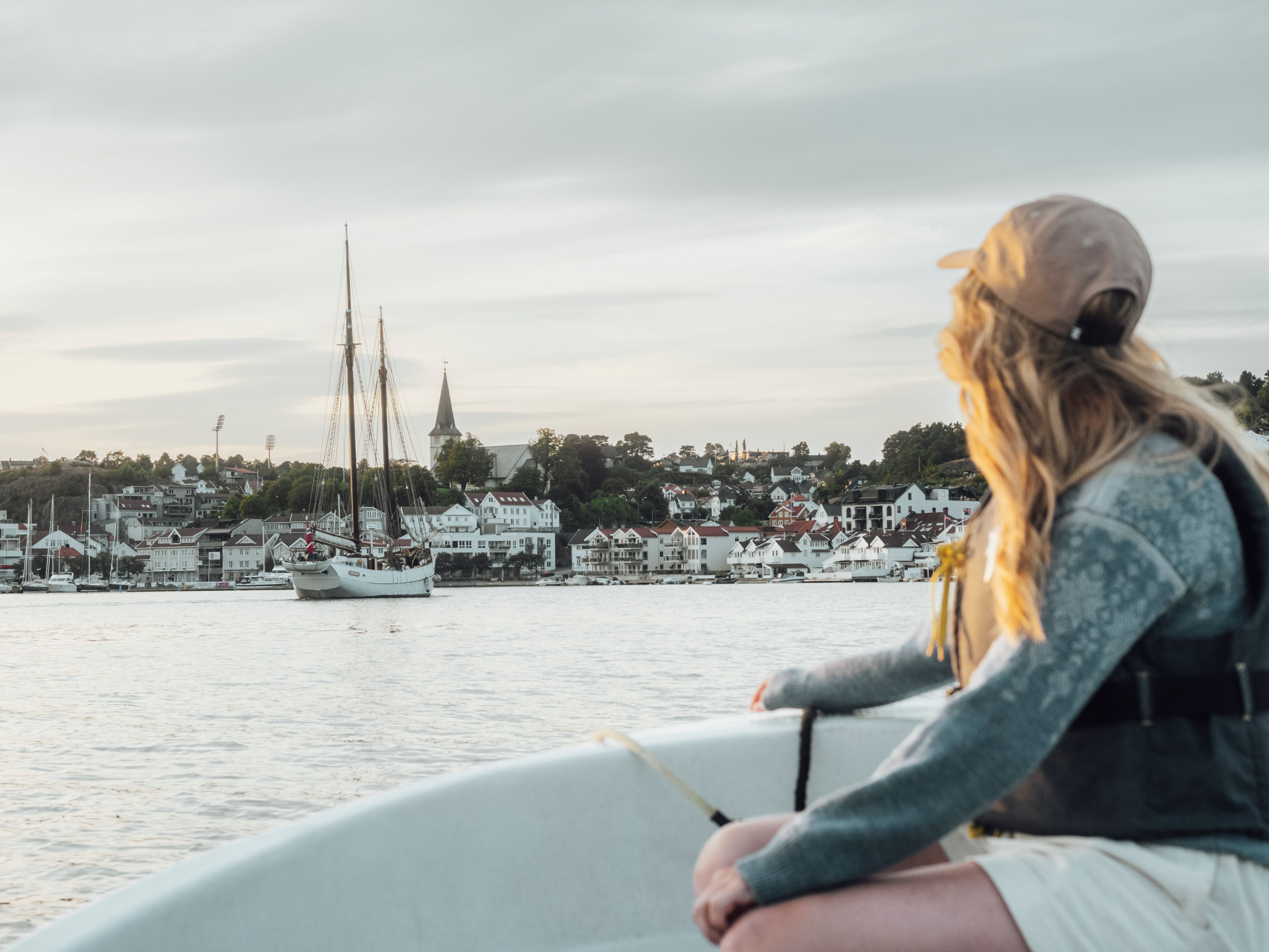 A woman in a boat on a summer day in Grimstad, Southern Norway