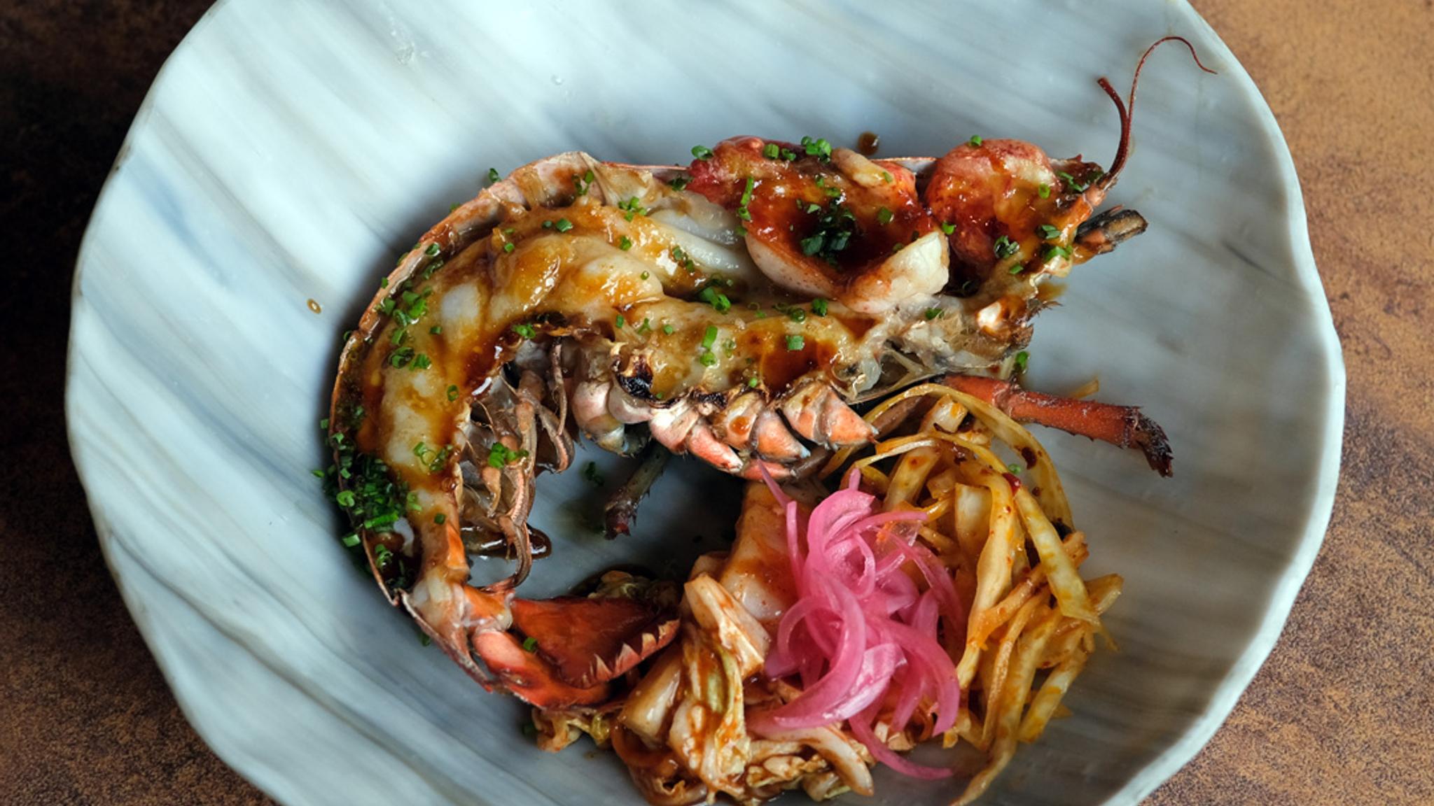 Food from the Michelin-Starred restaurant Sabi Omakase, on a plate.