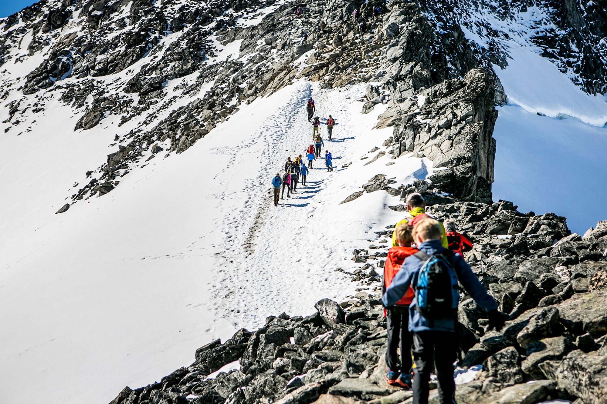 People doing the last climb to reach the top of Galdhøpiggen in Jotunheimen