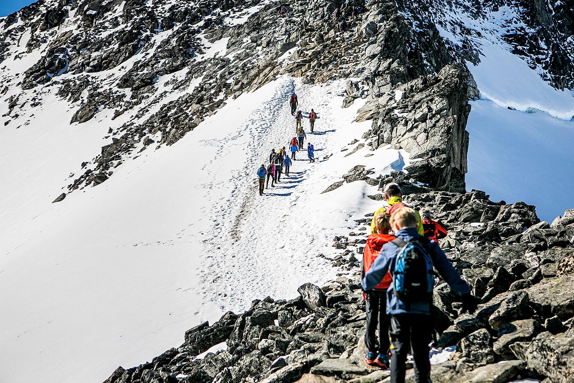 People doing the last climb to reach the top of Galdhøpiggen in Jotunheimen