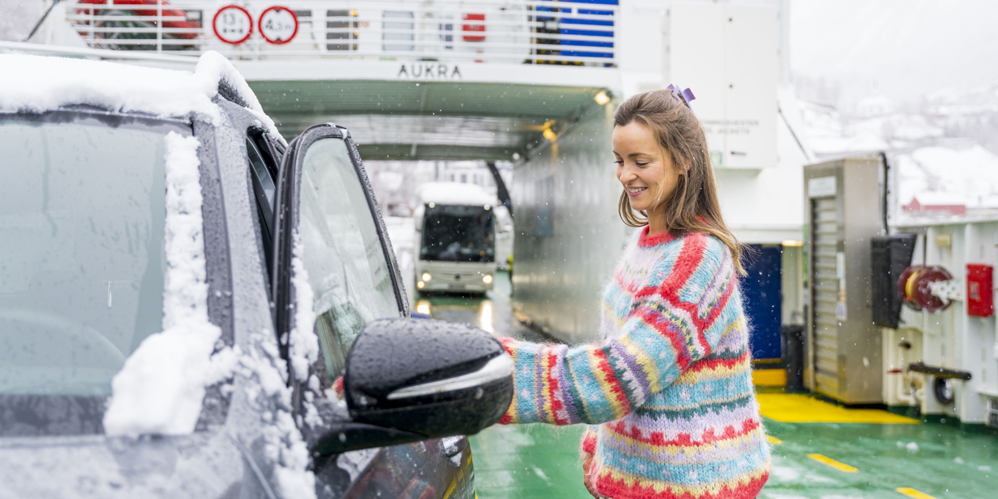 Woman entering car on the Fram ferry between Geiranger and Hellesylt