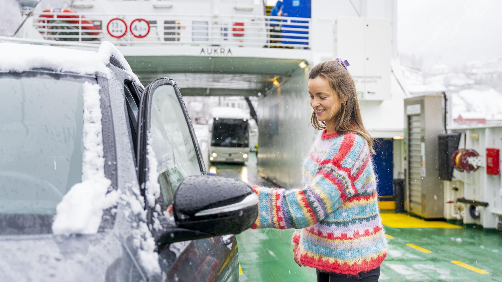 Woman entering car on the Fram ferry between Geiranger and Hellesylt