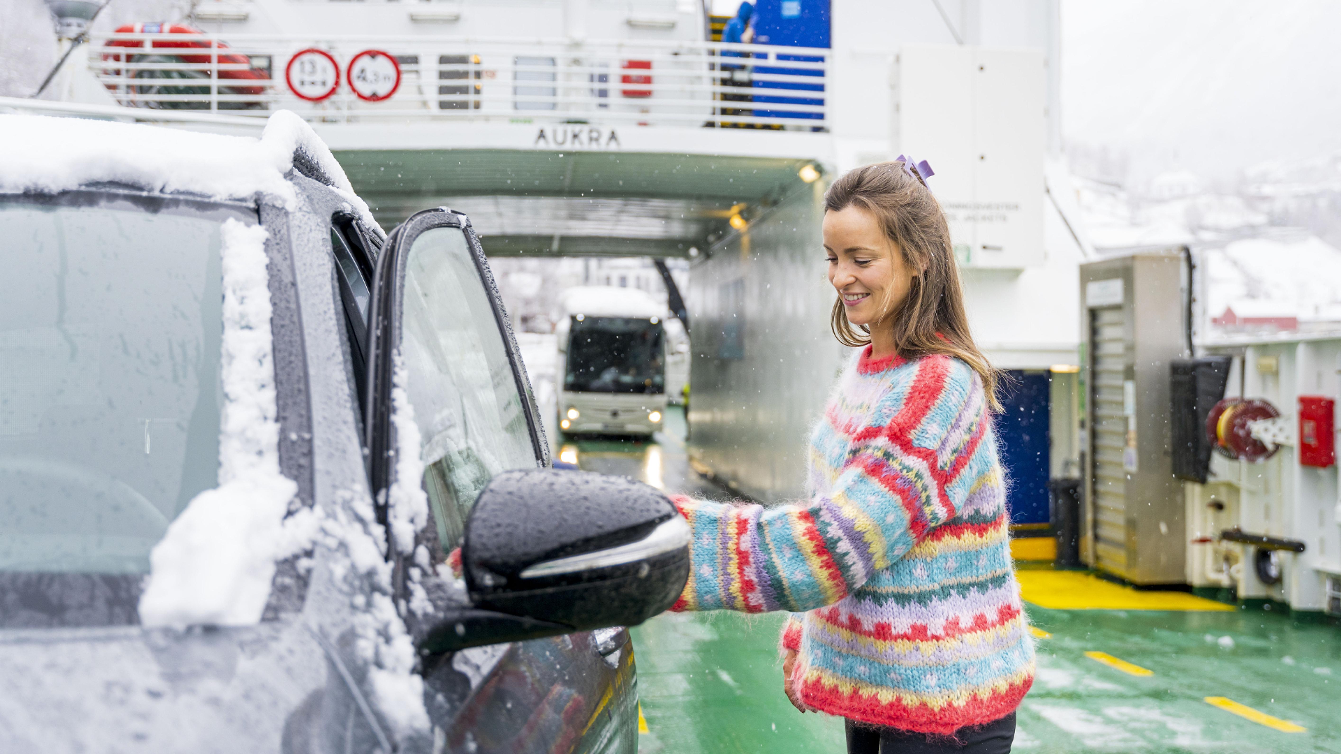 Woman entering car on the Fram ferry between Geiranger and Hellesylt