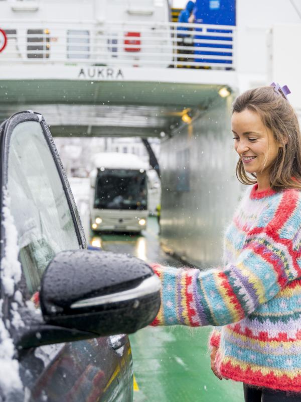 Woman entering car on the Fram ferry between Geiranger and Hellesylt